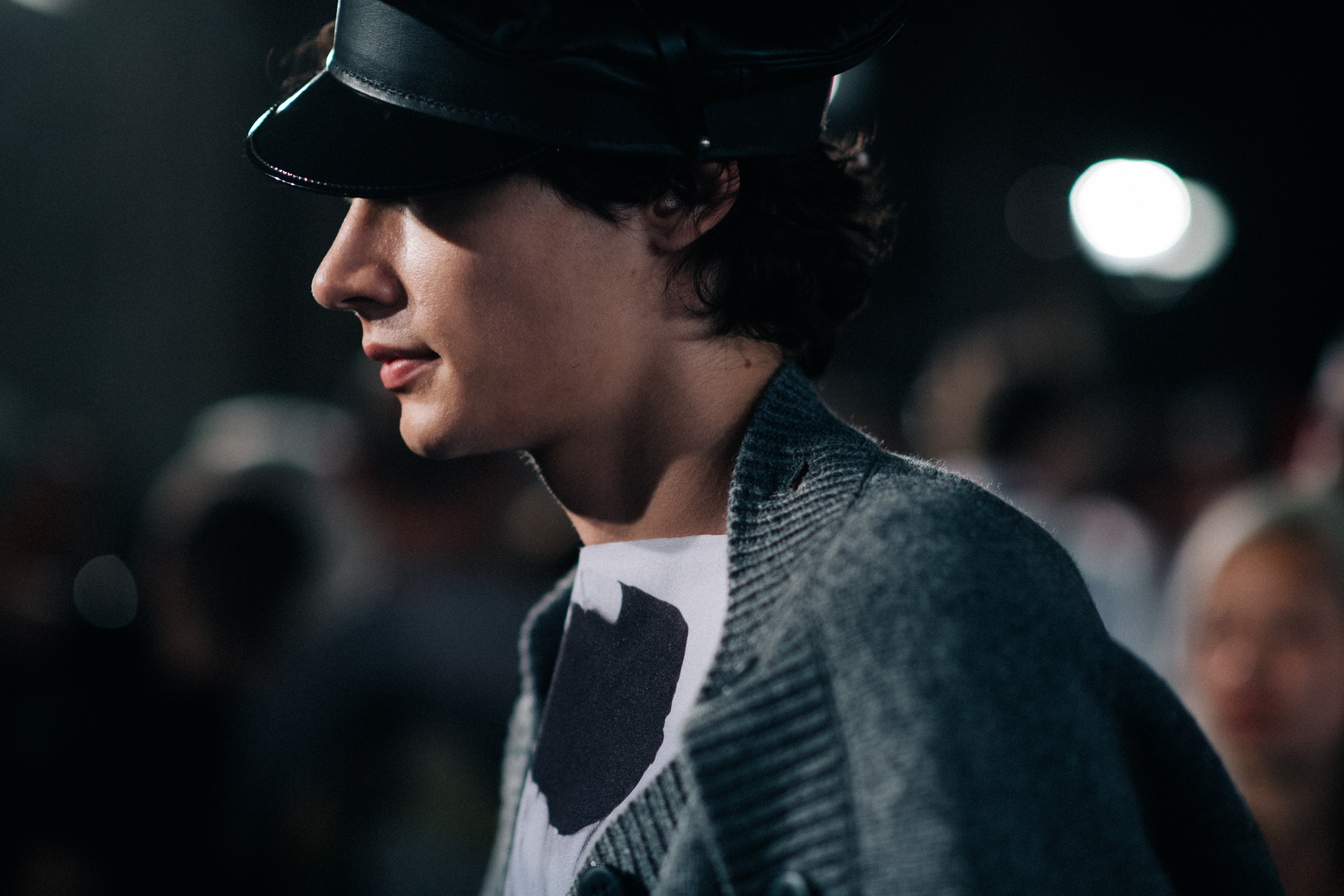 A male model posing backstage