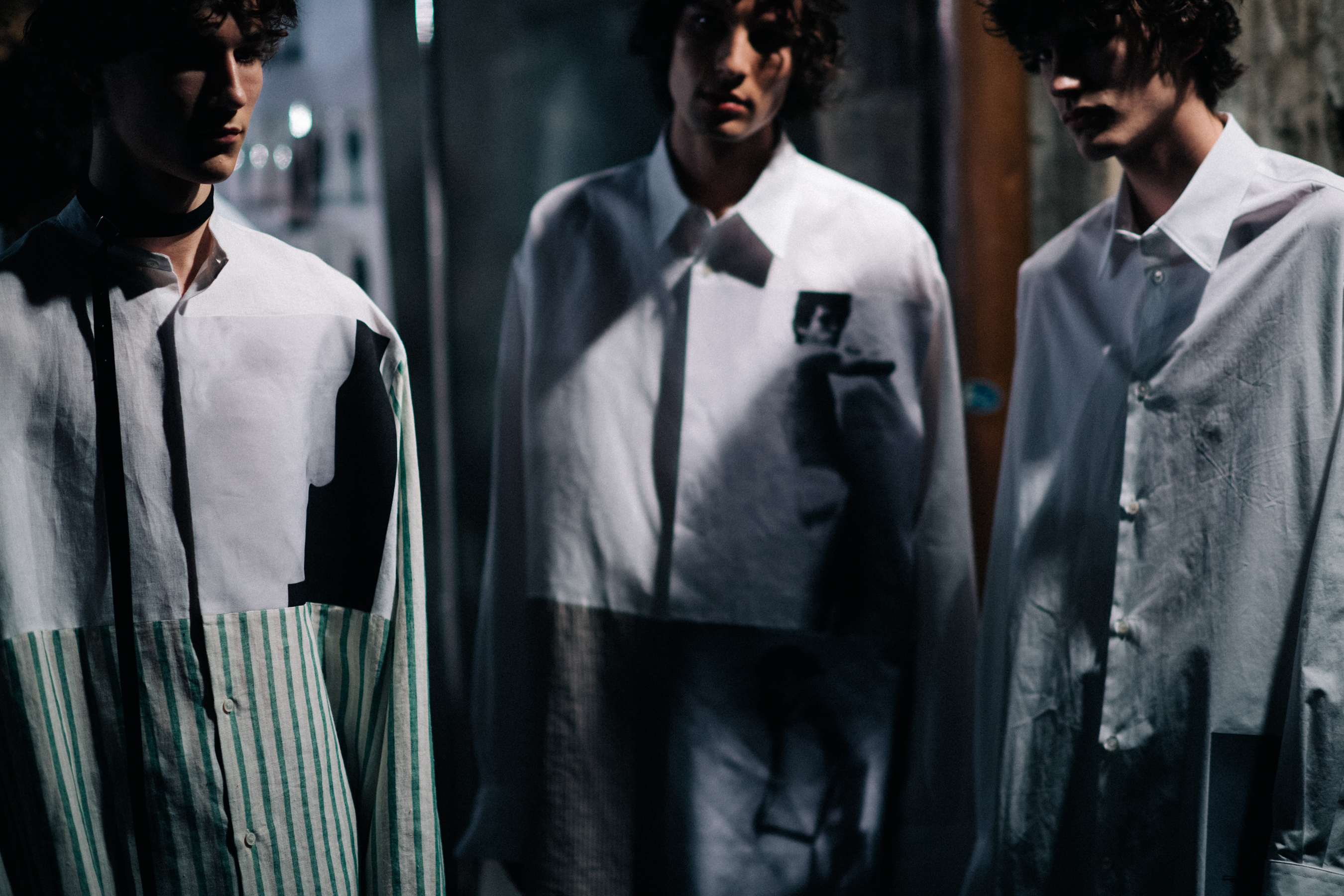 Male models posing in white shirts