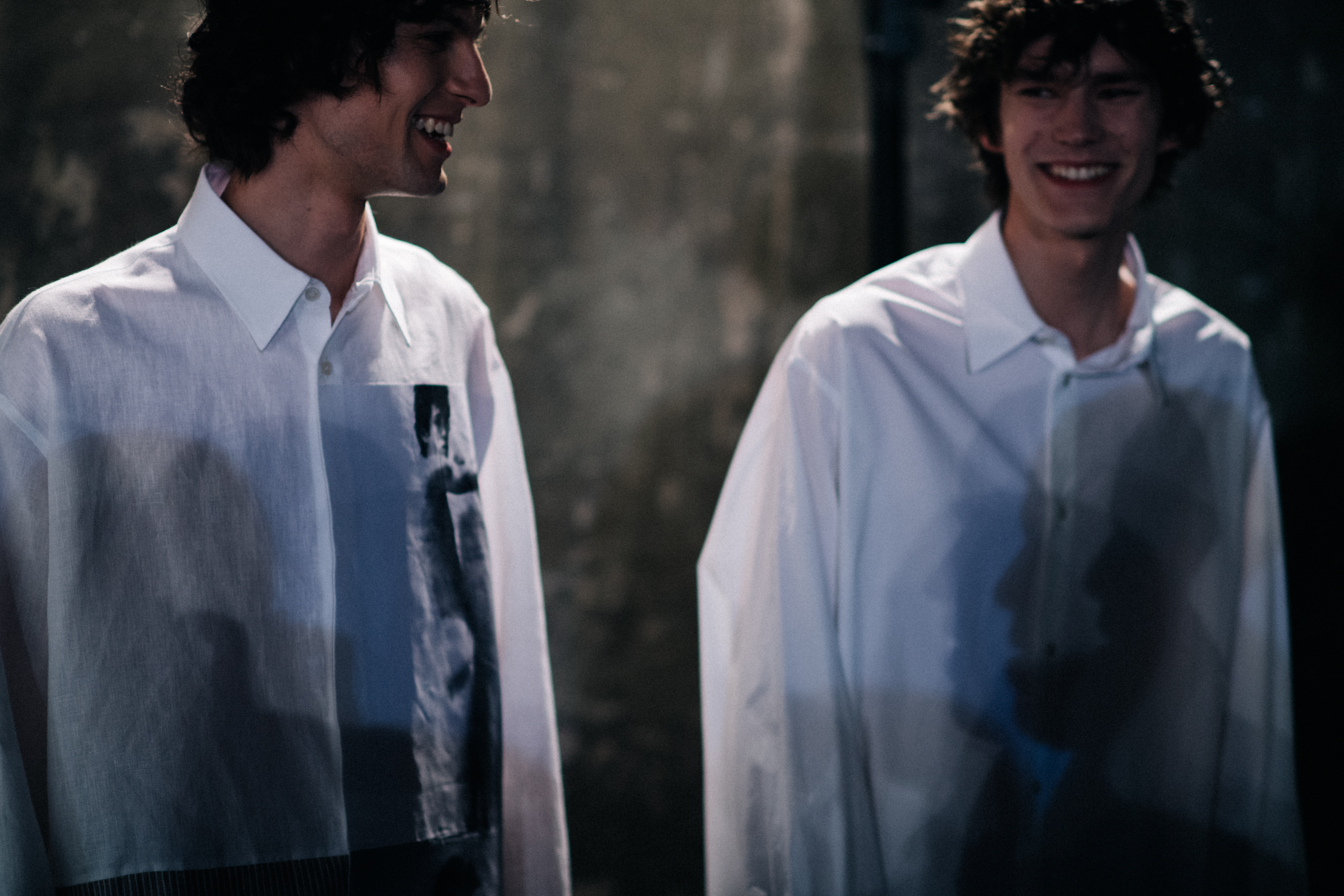 Two male models in white shirts