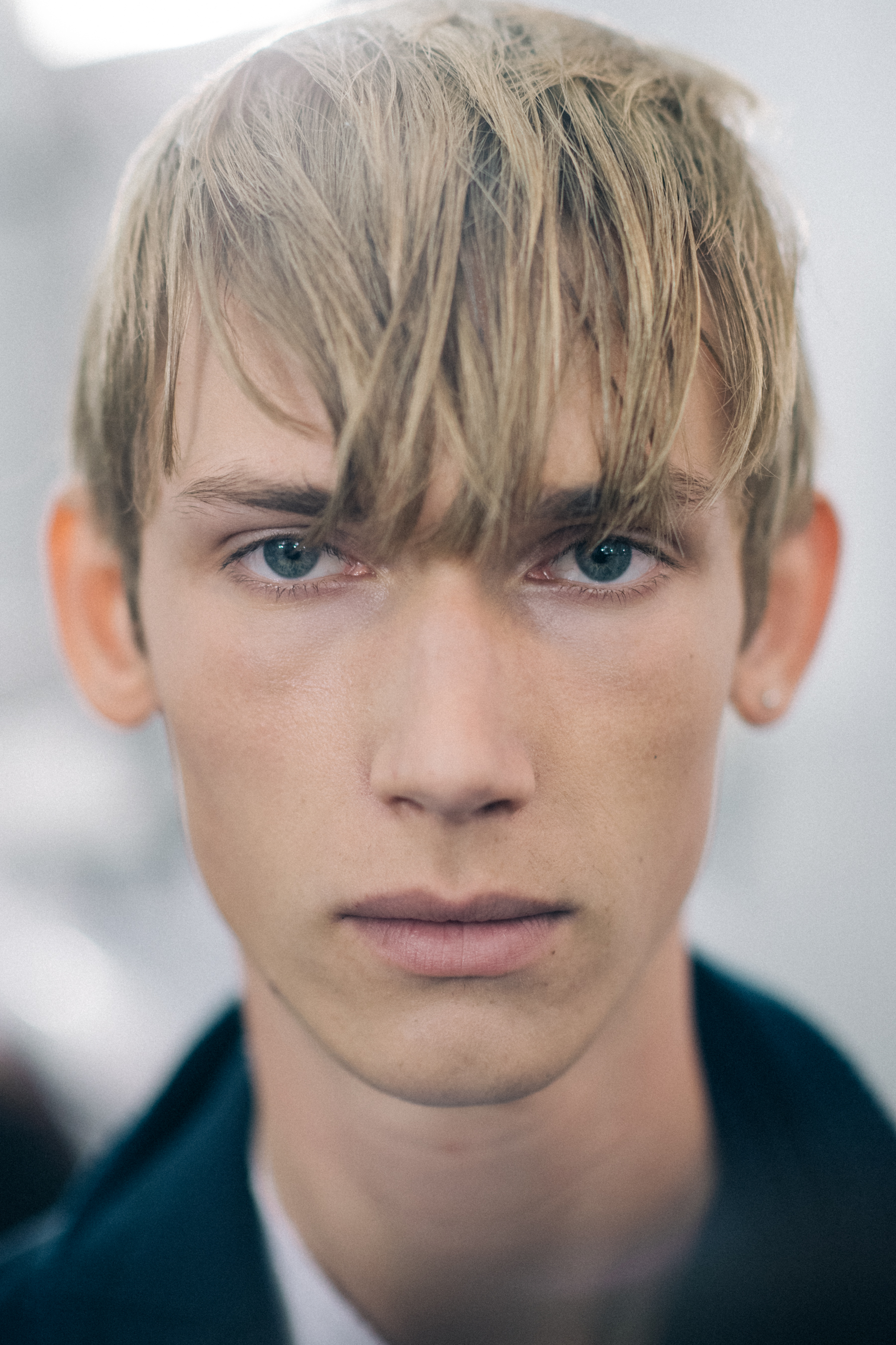 Blond blue-eyed male model portrait