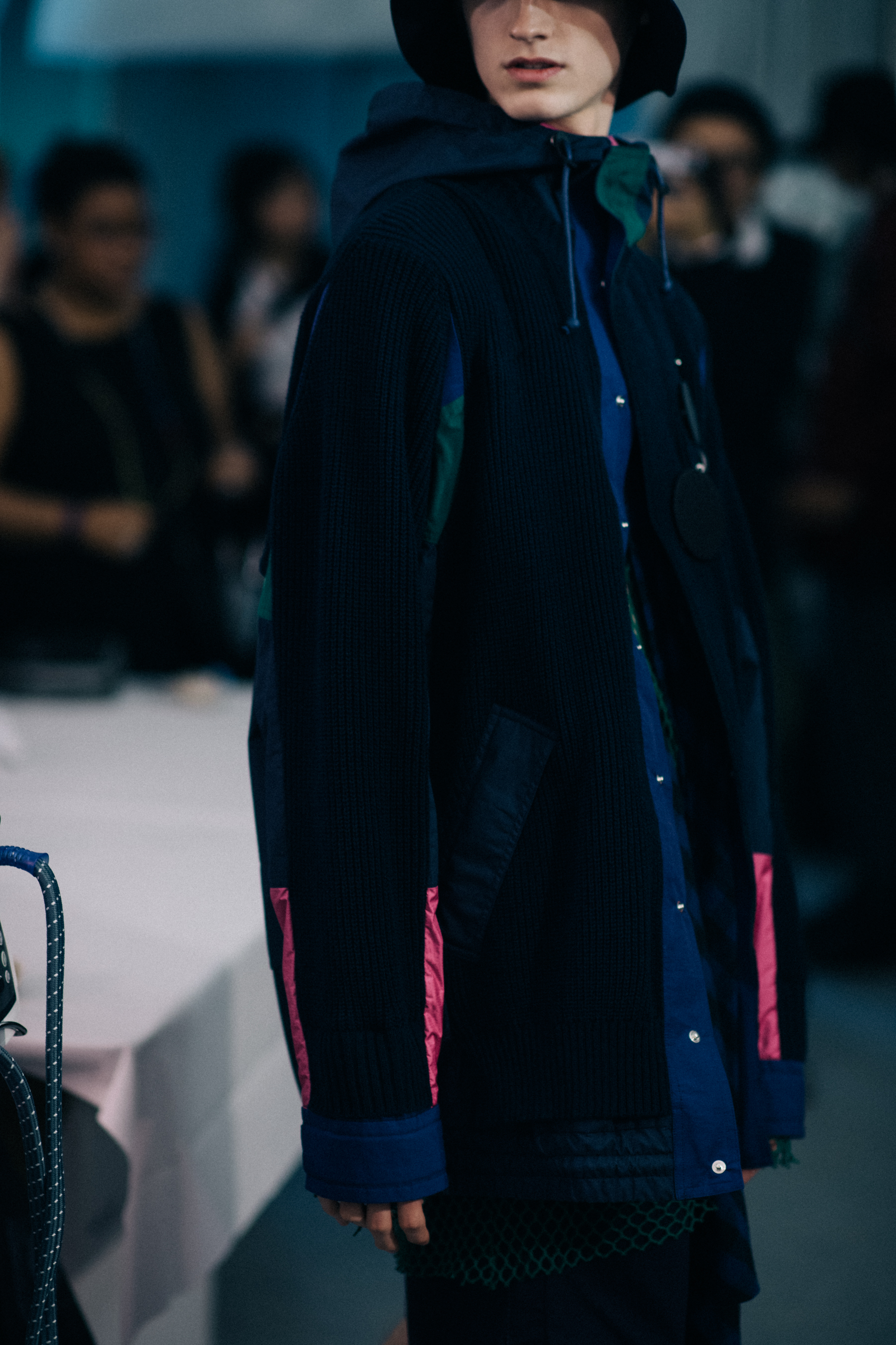 Model wearing dark oversize jacket
