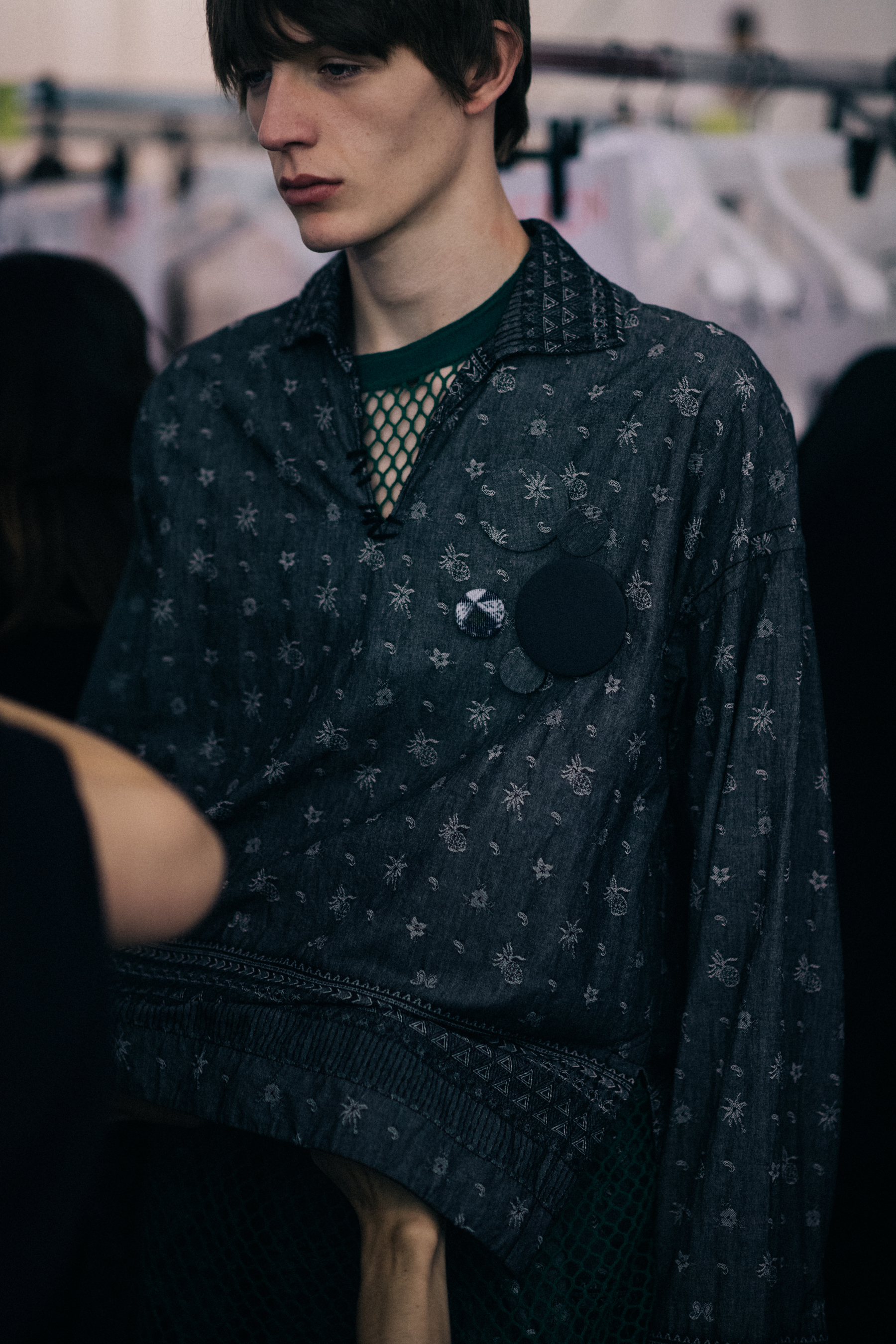Male model wearing printed shirt