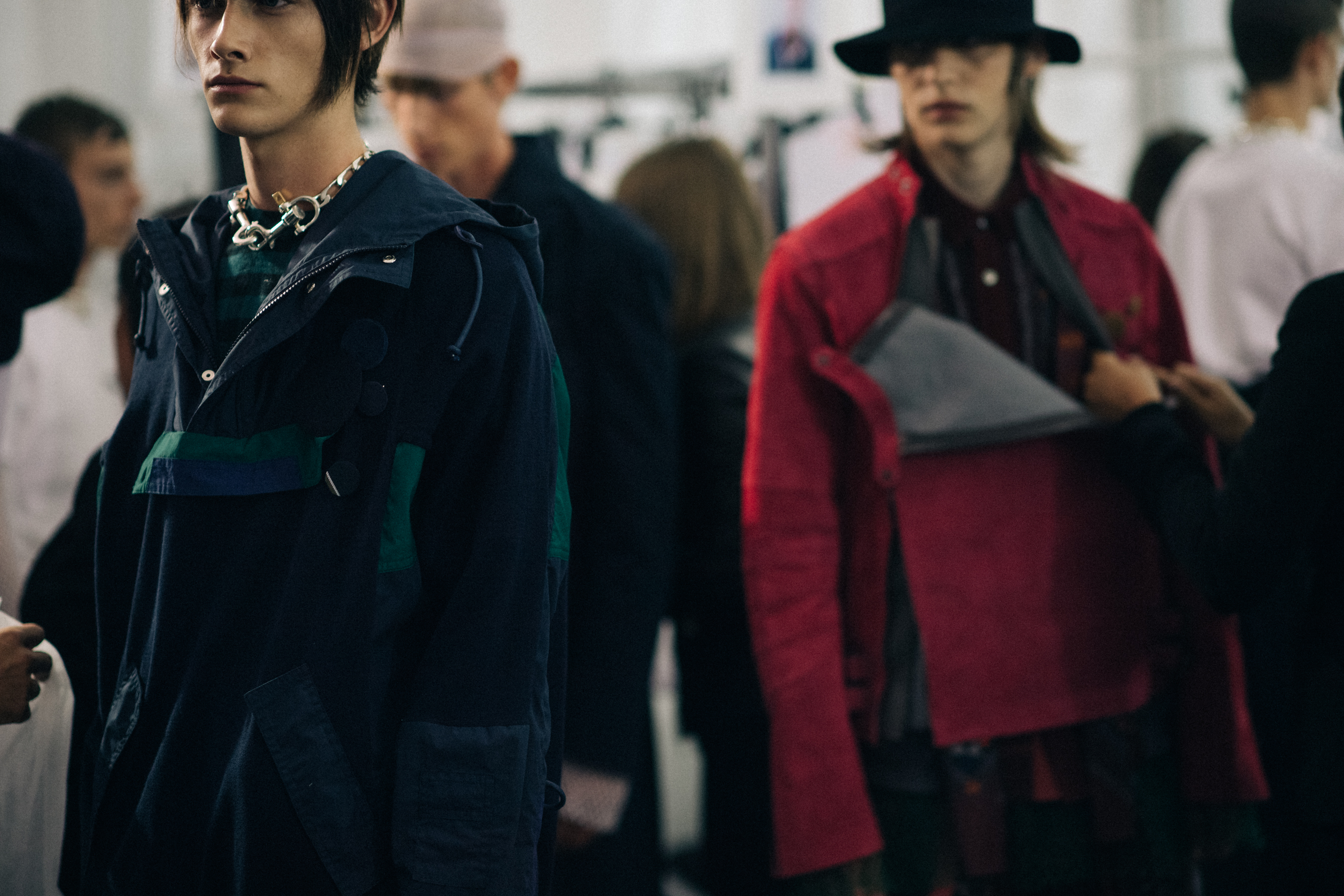 Male models wearing colourful jackets