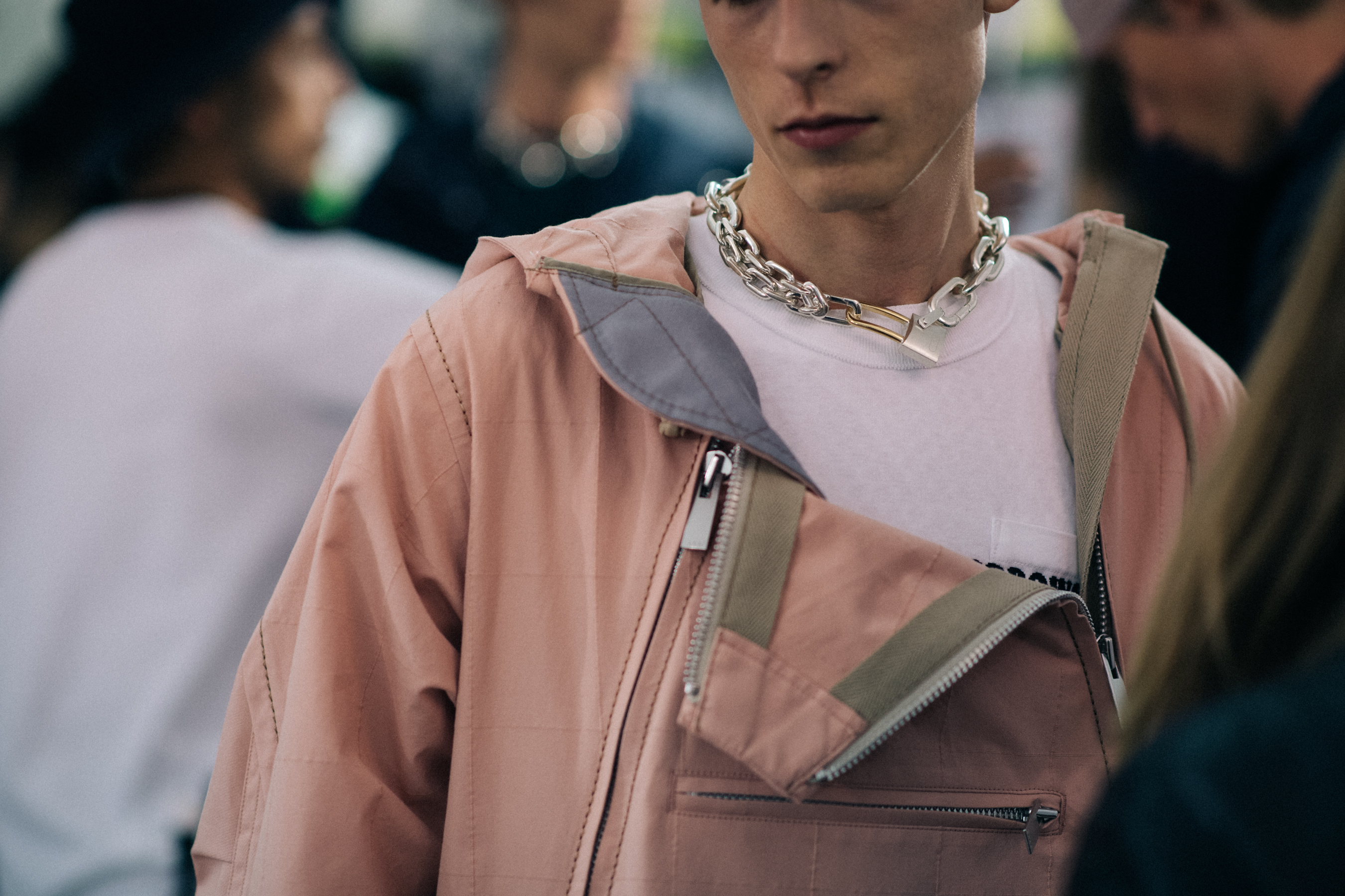 Model in pastel pink jacket