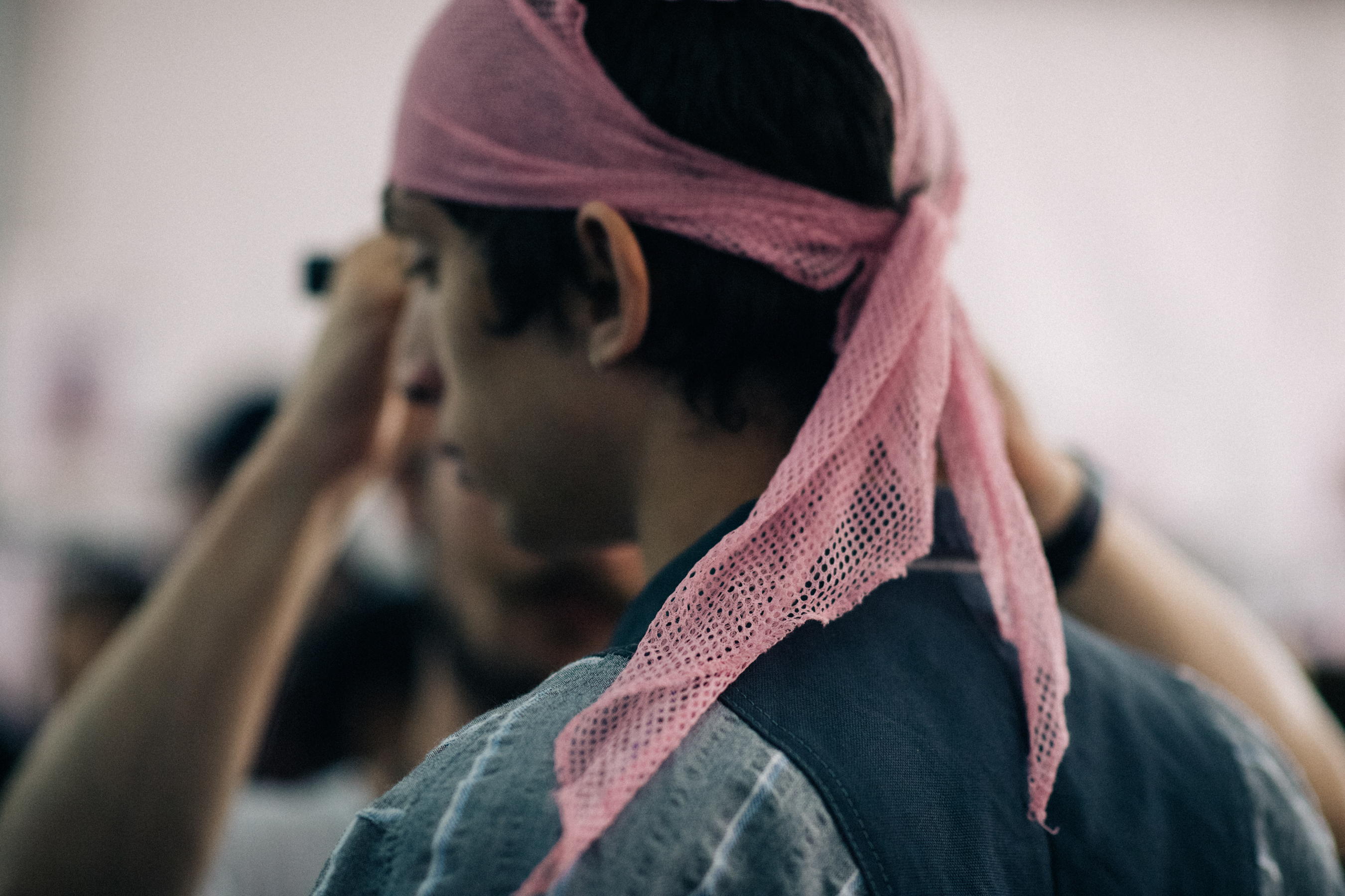 Male model wearing pink accessory