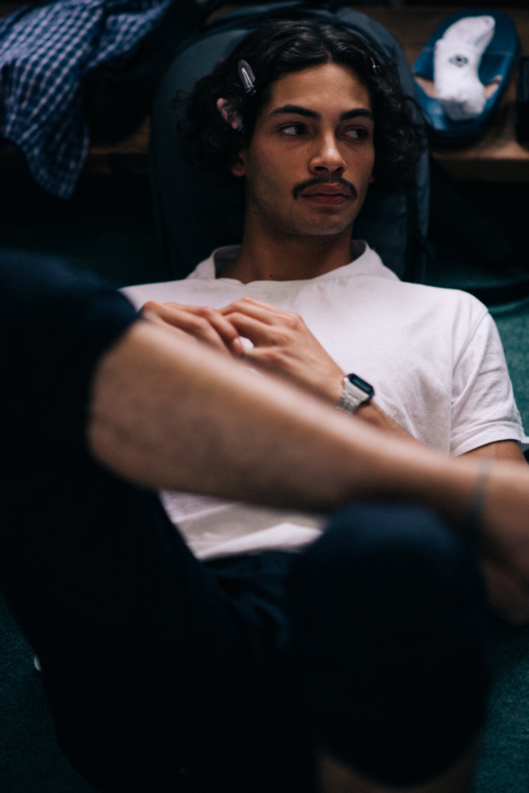 A male model in a white polo shirt