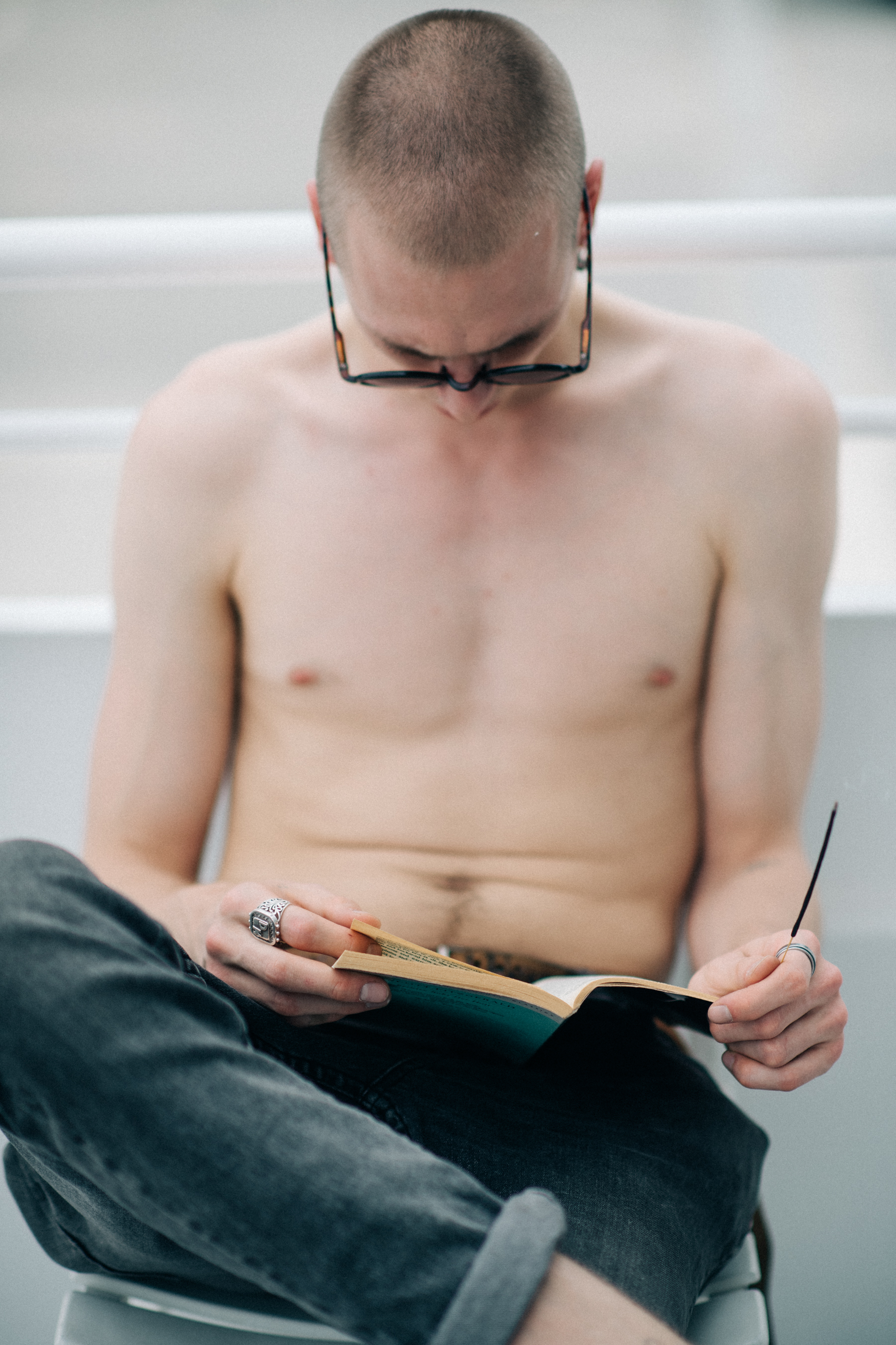 A male model reading a book