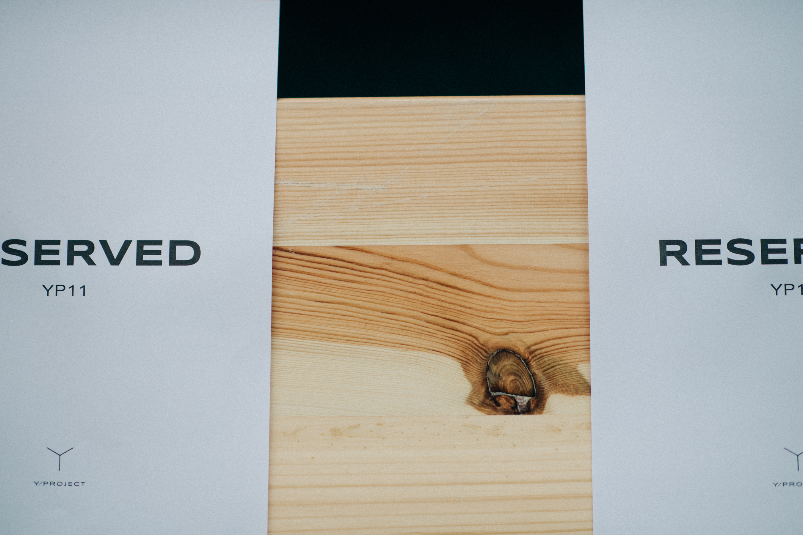 Printed invitations on wooden seats