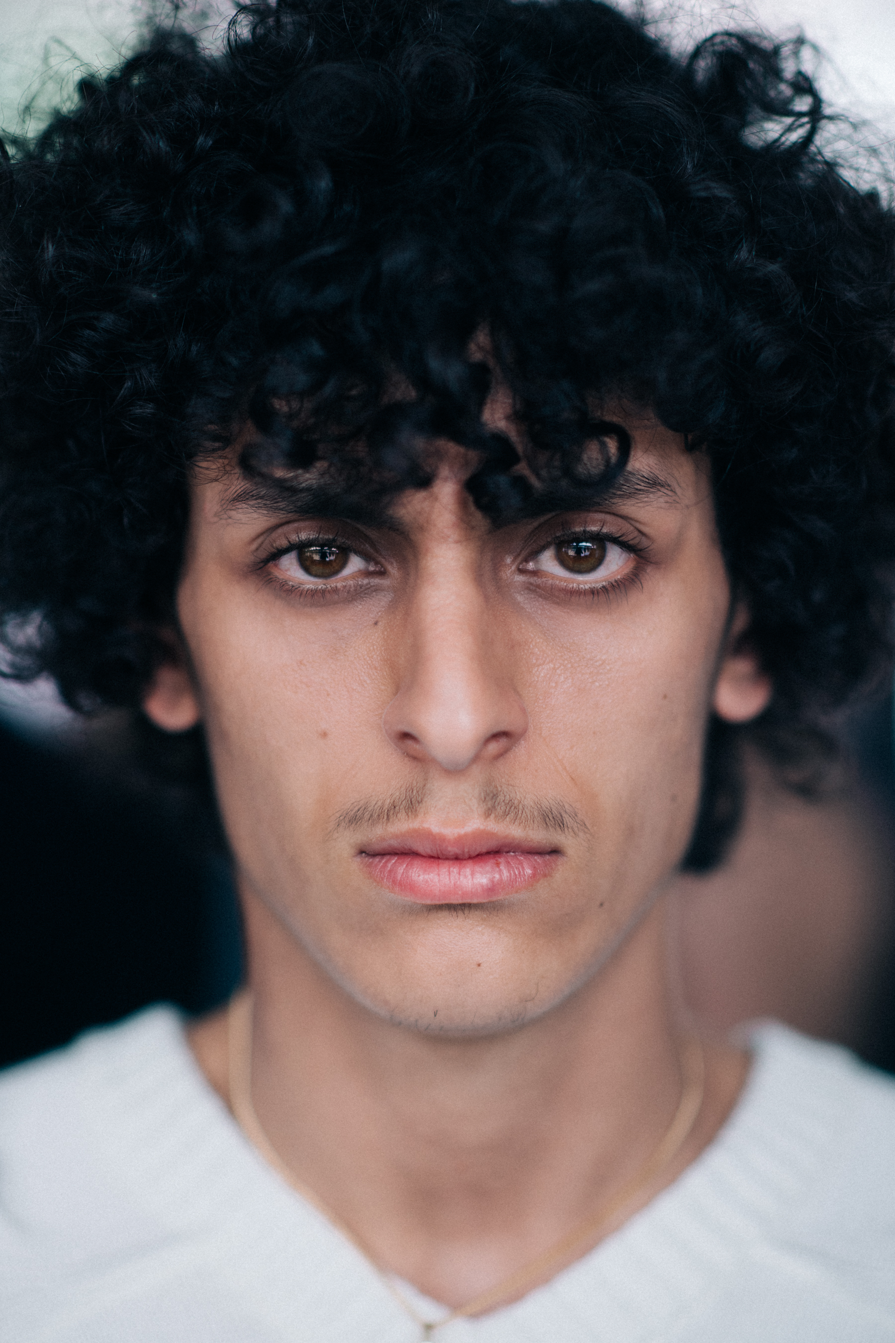A male model with curly hair