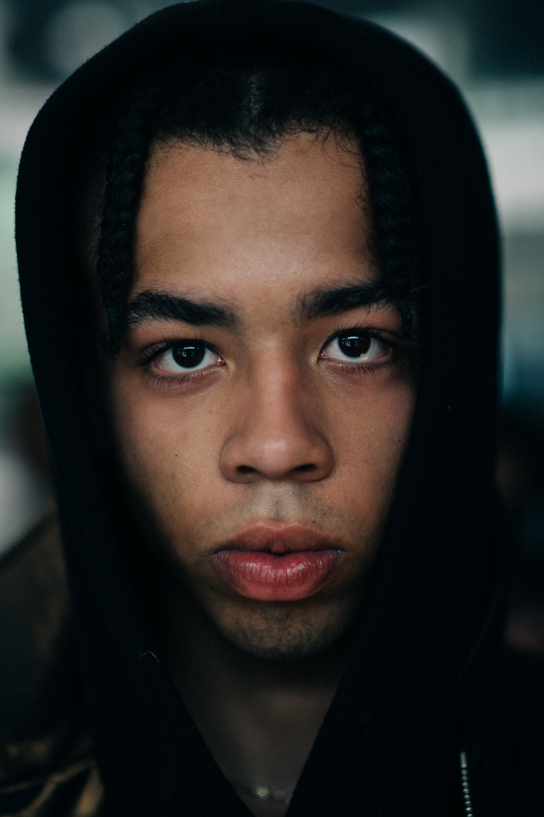 Picture of a model in a black hoodie