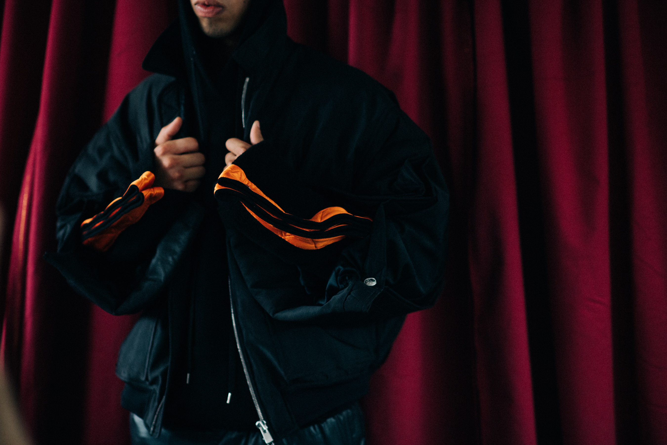 A black jakcet with orange stripes