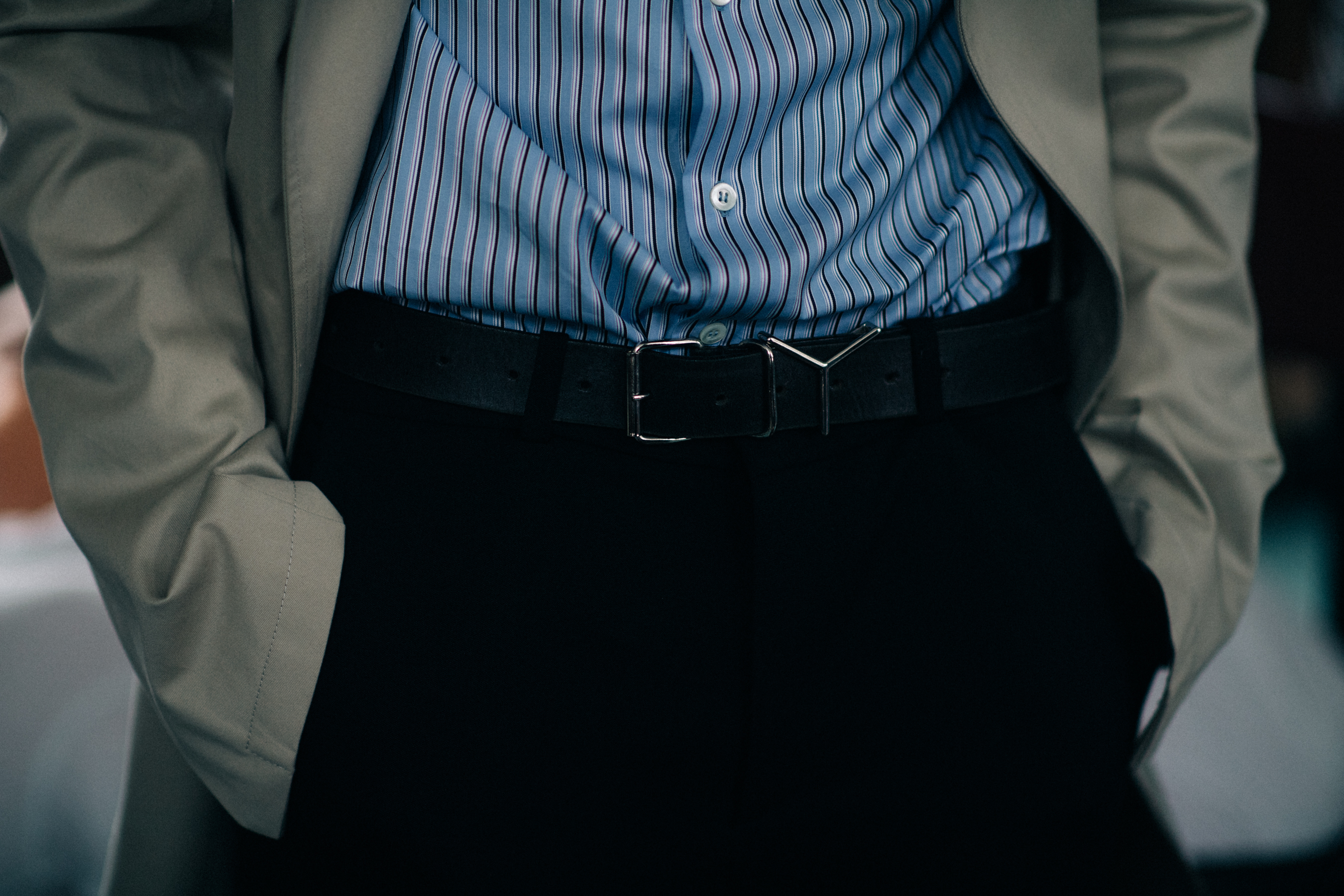 A model in a blue striped shirt