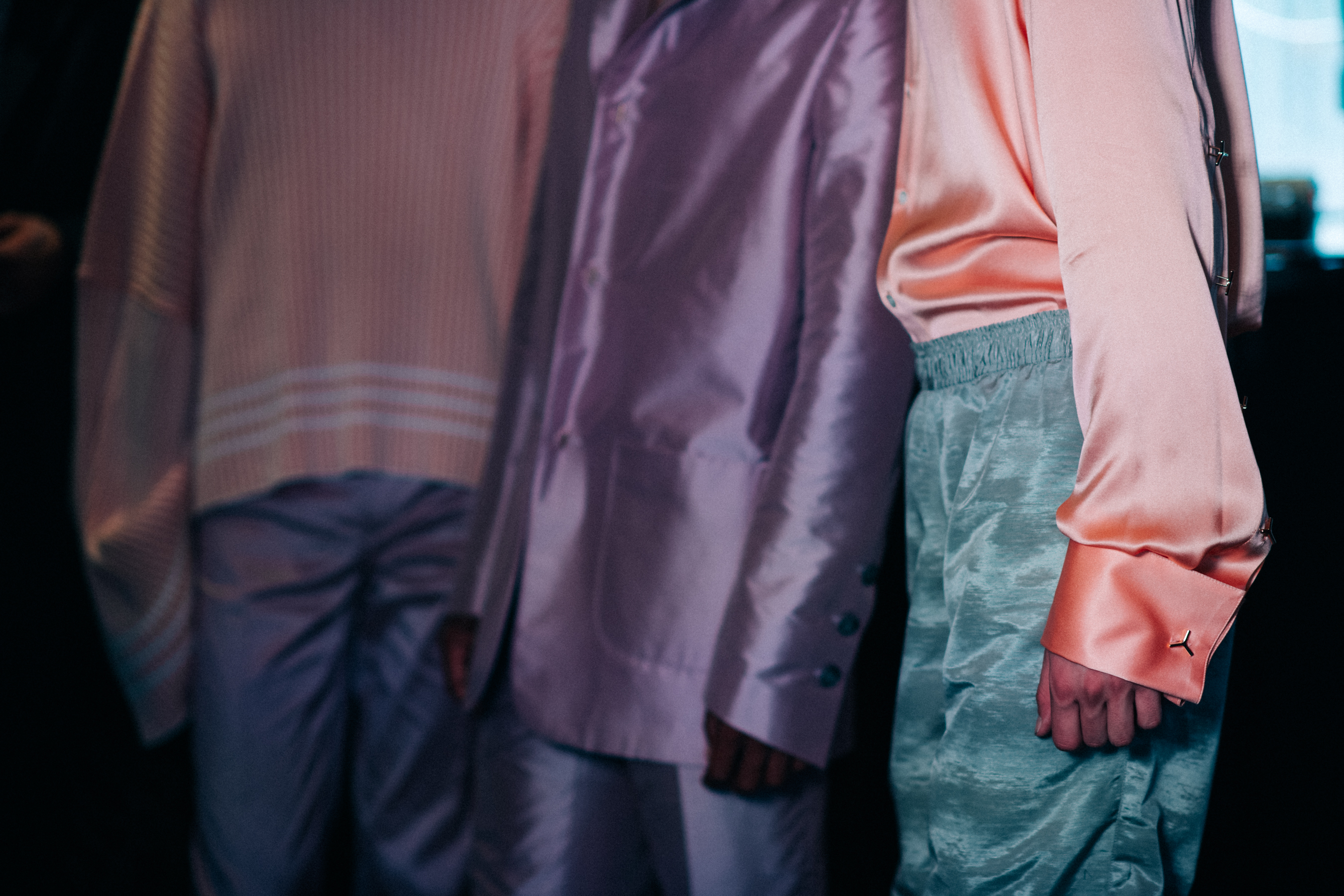 Models wearing outfits with pastel colours