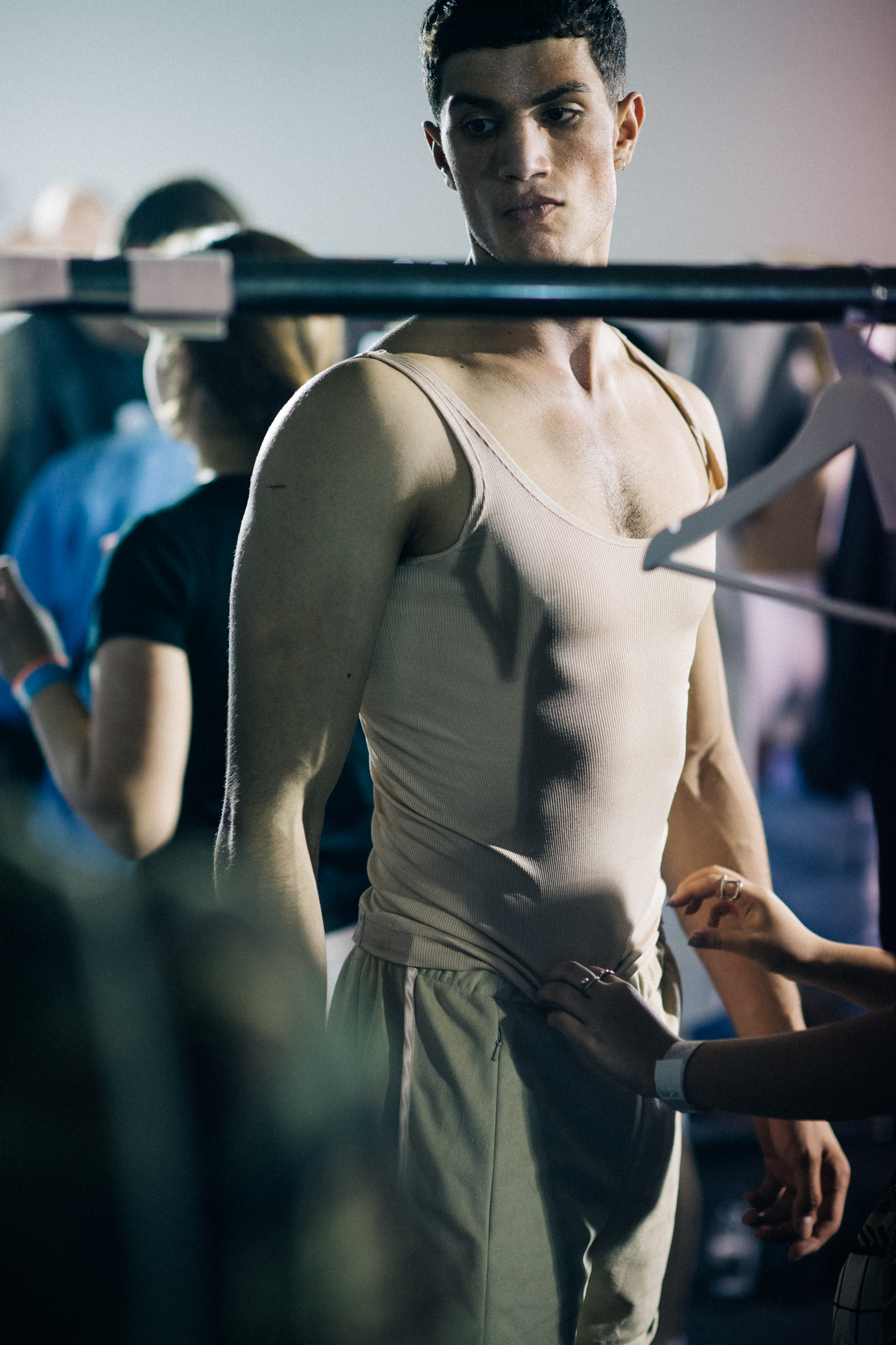 Male model getting dressed