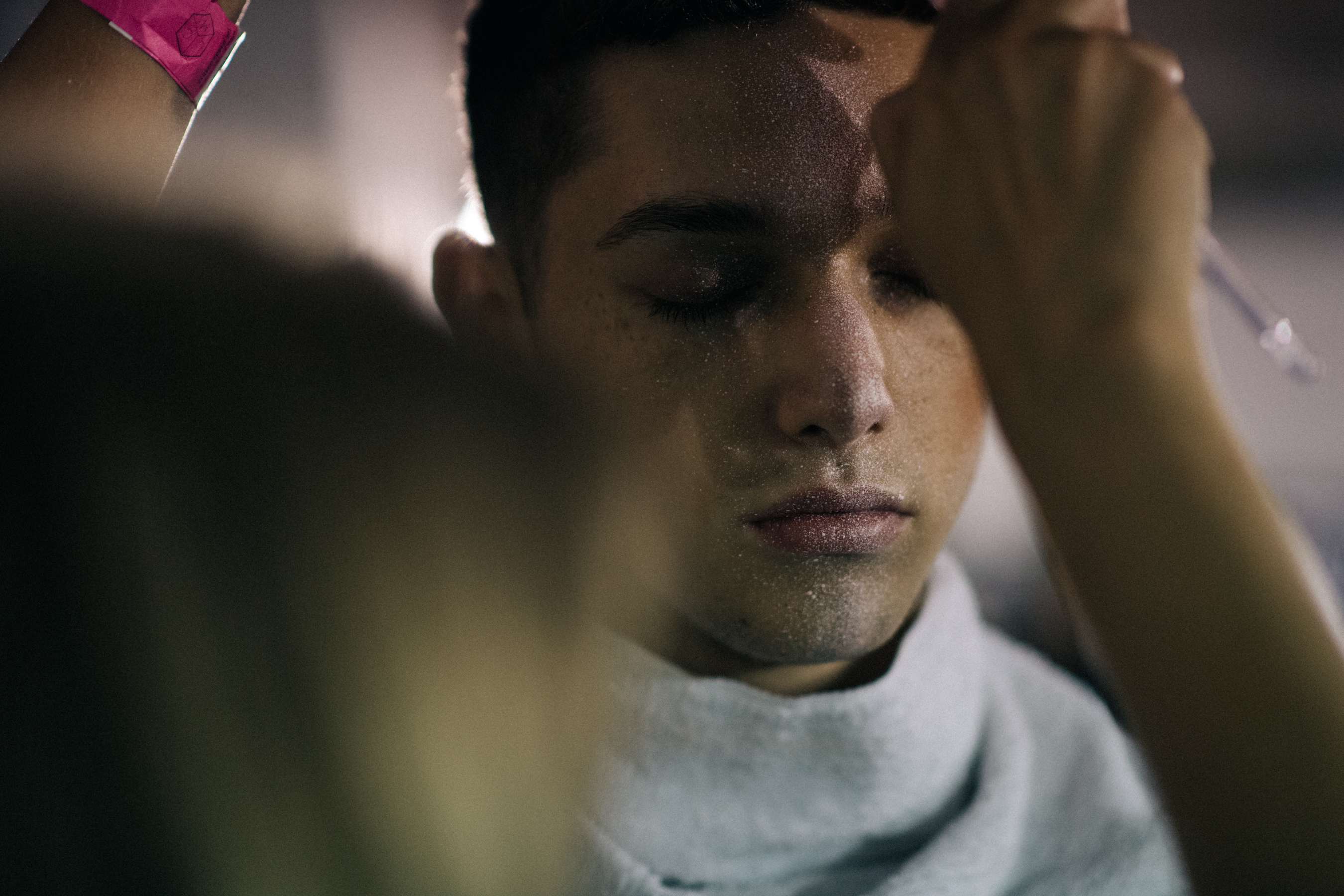 Model getting his make-up done