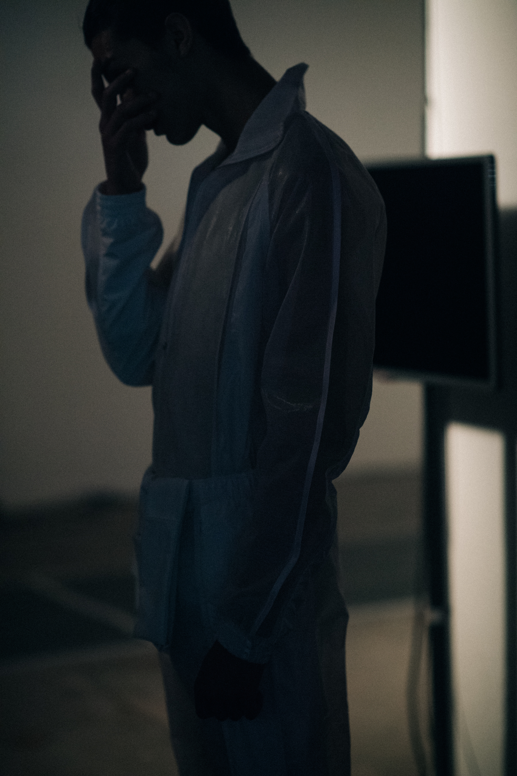 Model wearing a dark grey outfit