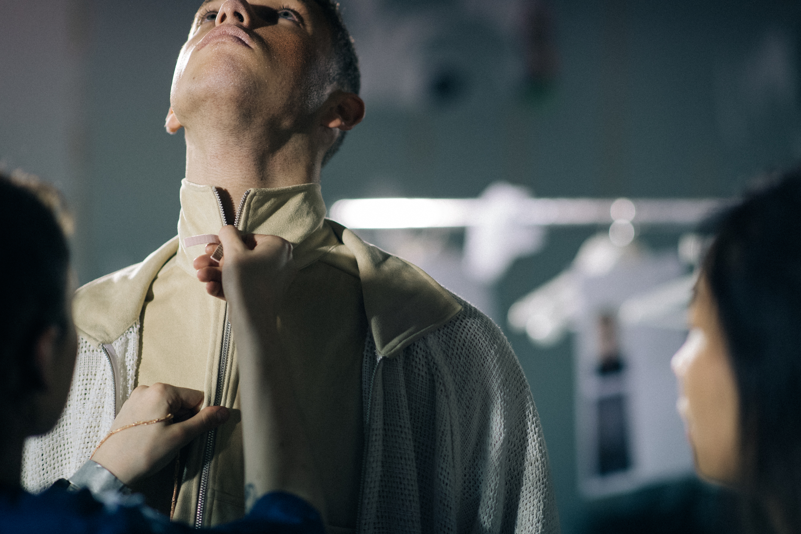 A male model getting dressed