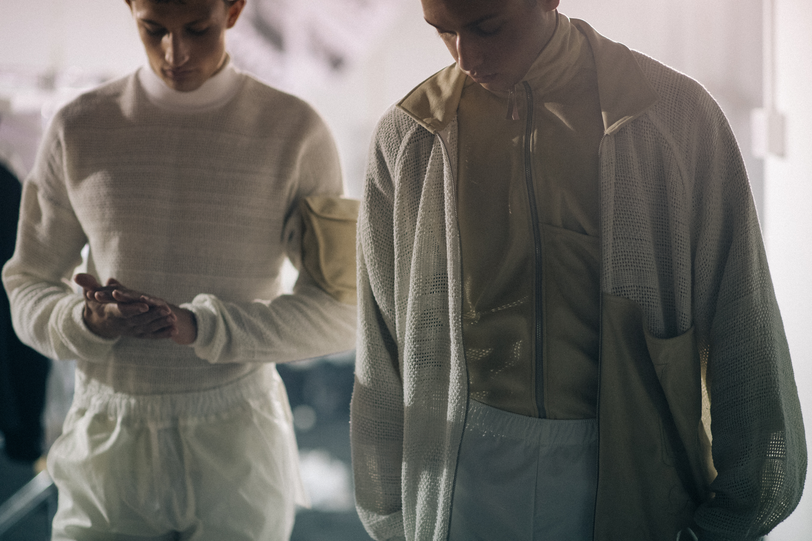 Two male models in beige outfits