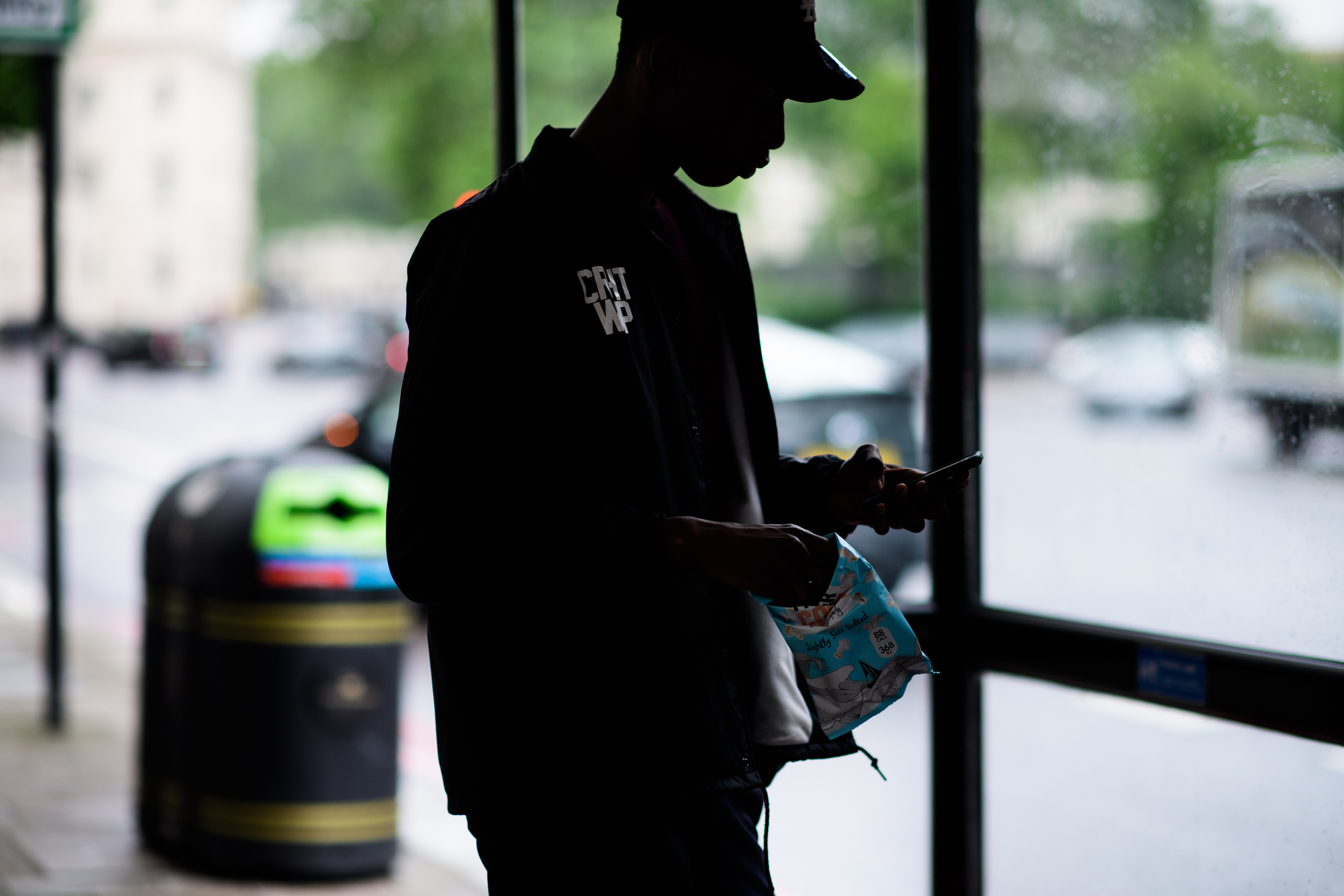 A male model in a hat outside