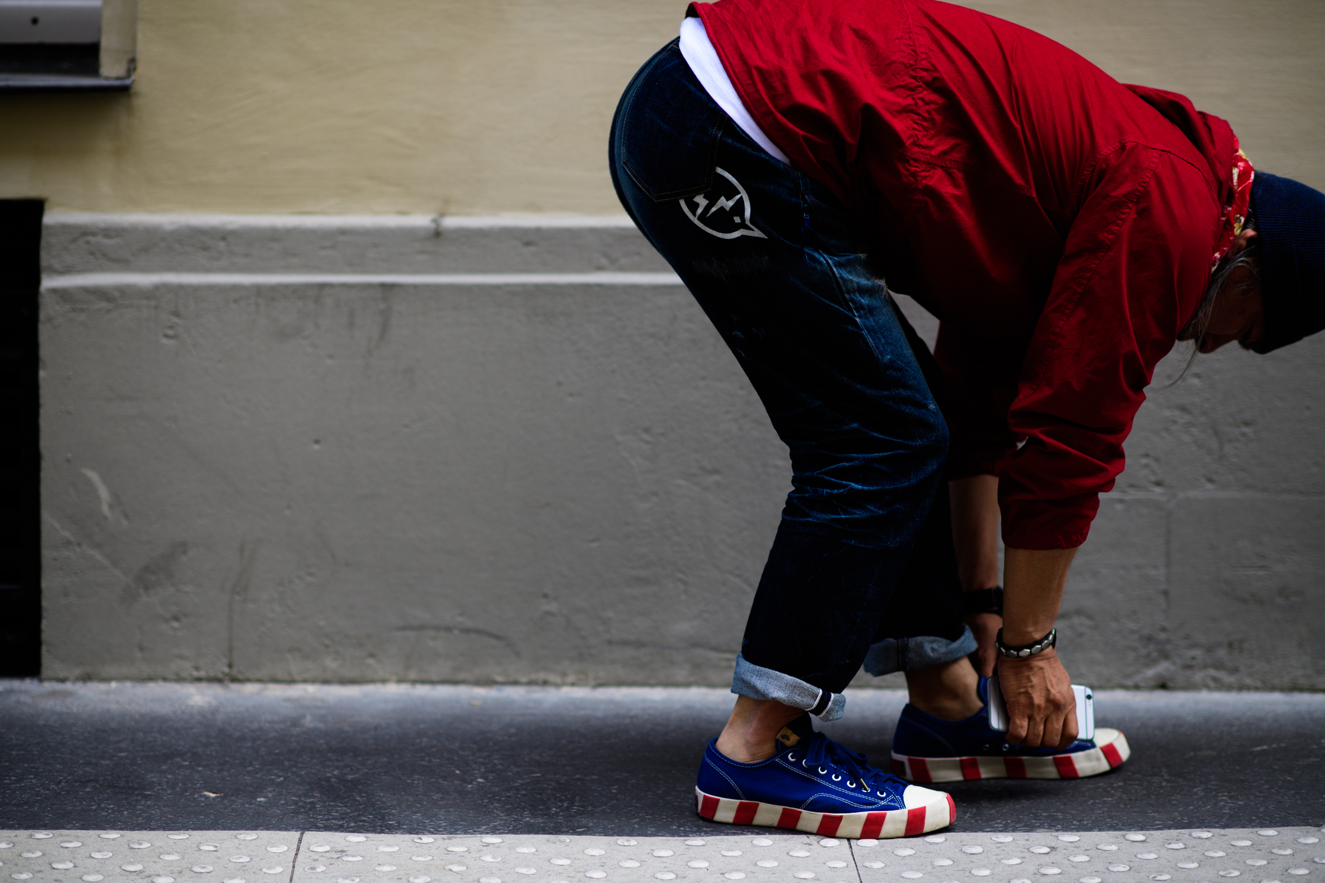 Red hoodie worn with dark jeans