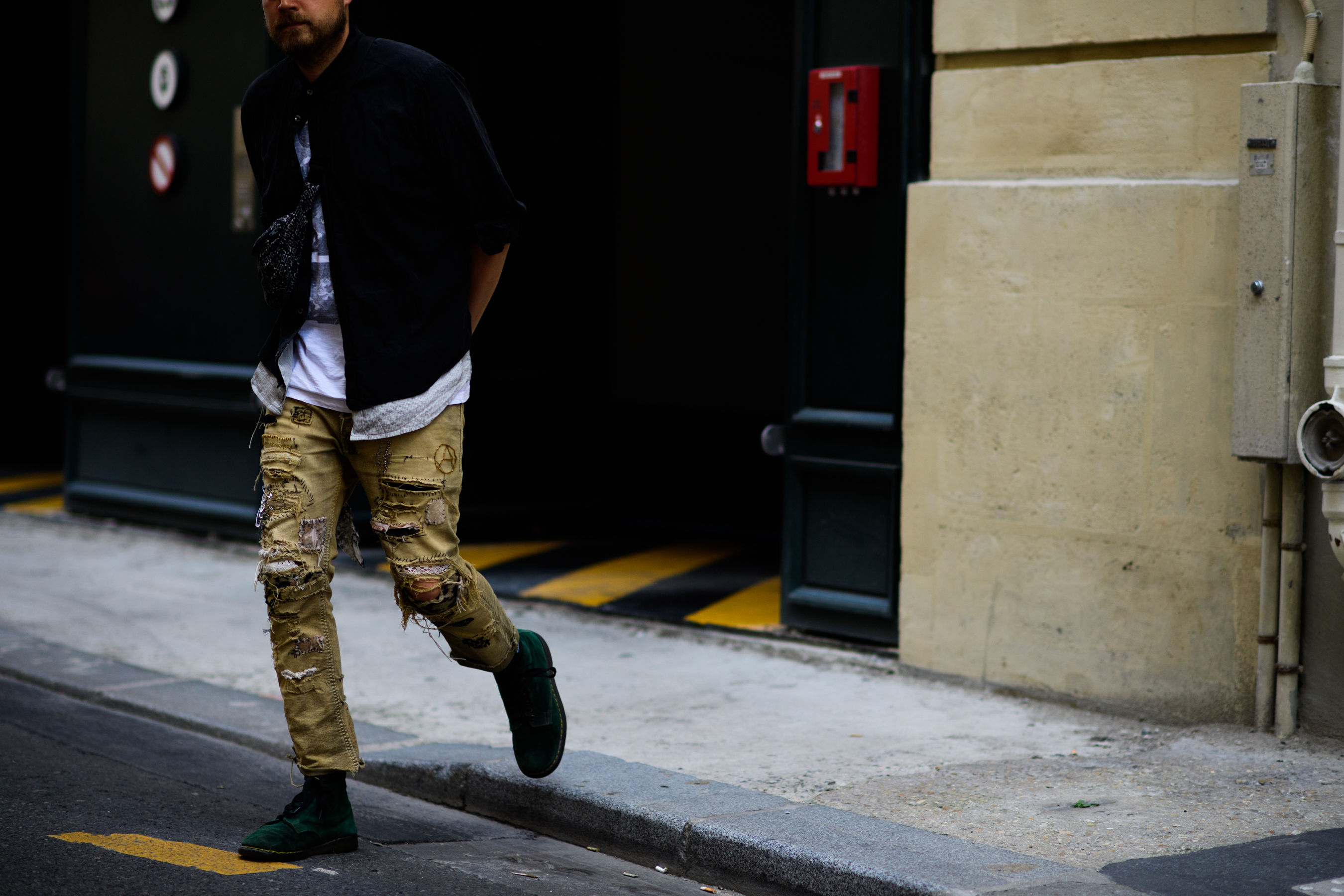 A man wearing beige trousers