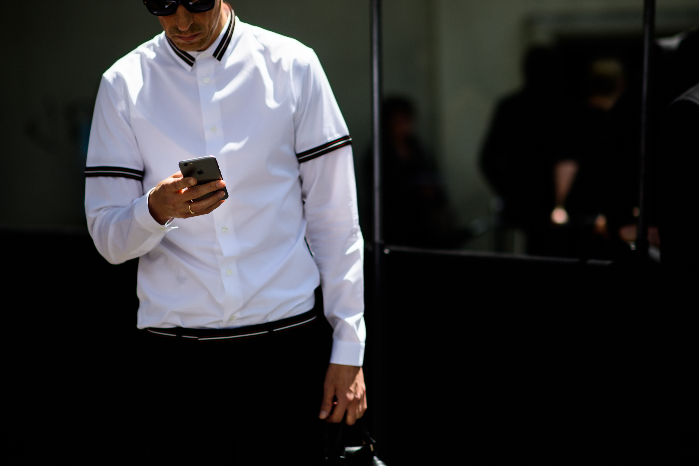 Man wearing polo over shirt