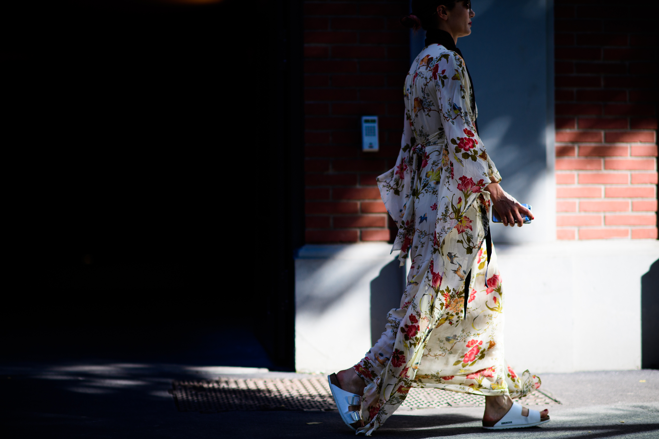 A woman wearing a floral dress