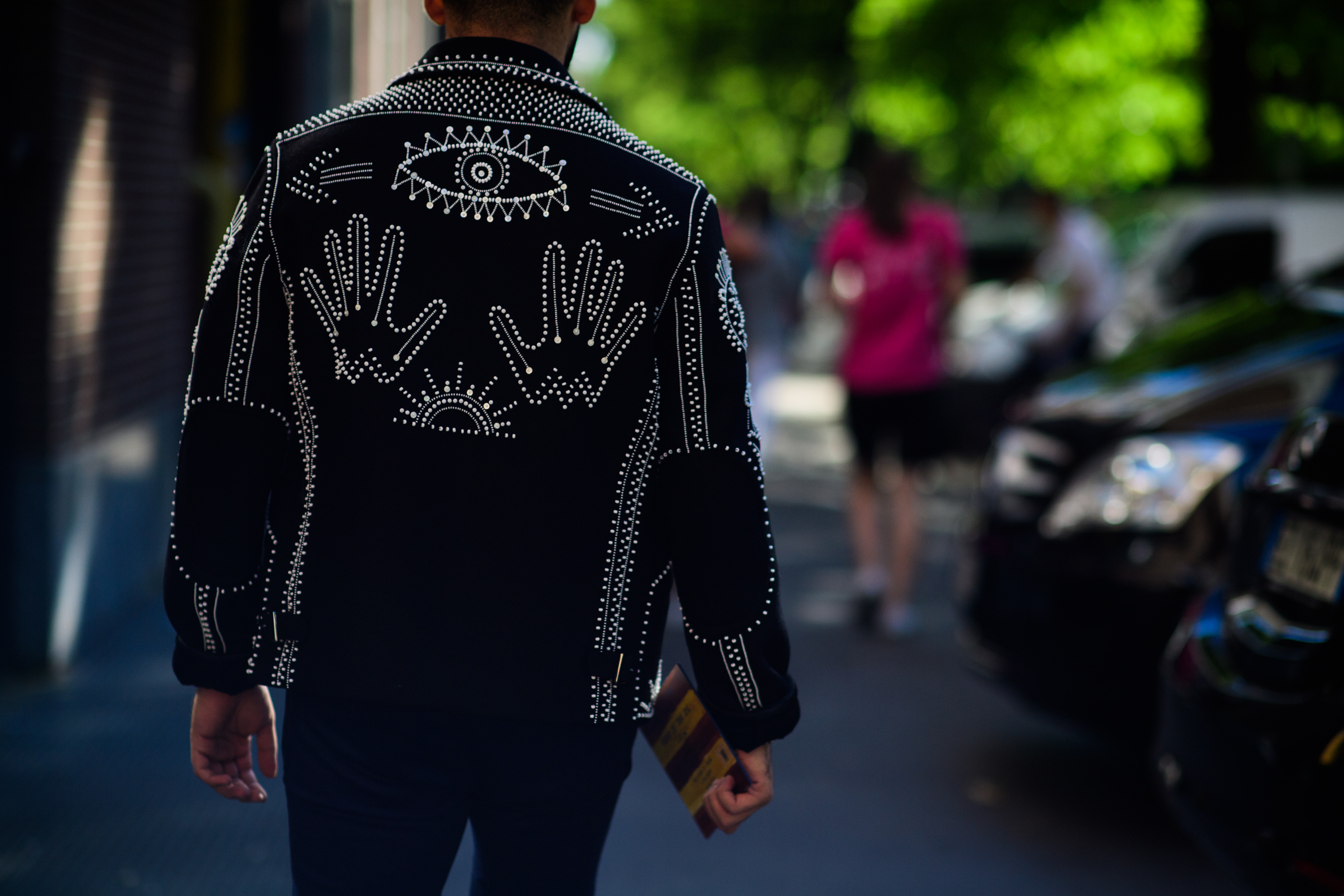 A man wearing an embroidered jacket