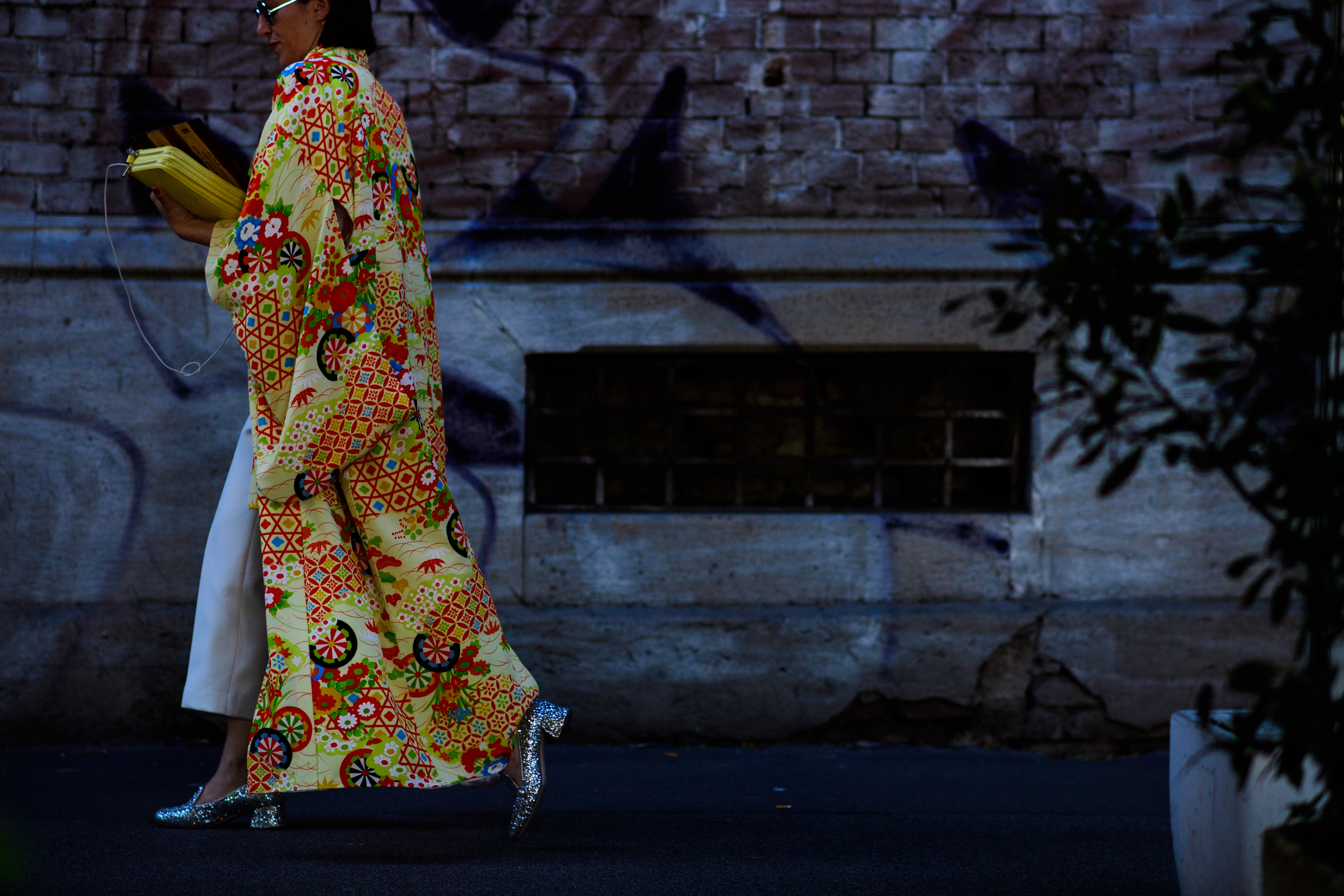 A woman wearing a yellow maxi coat