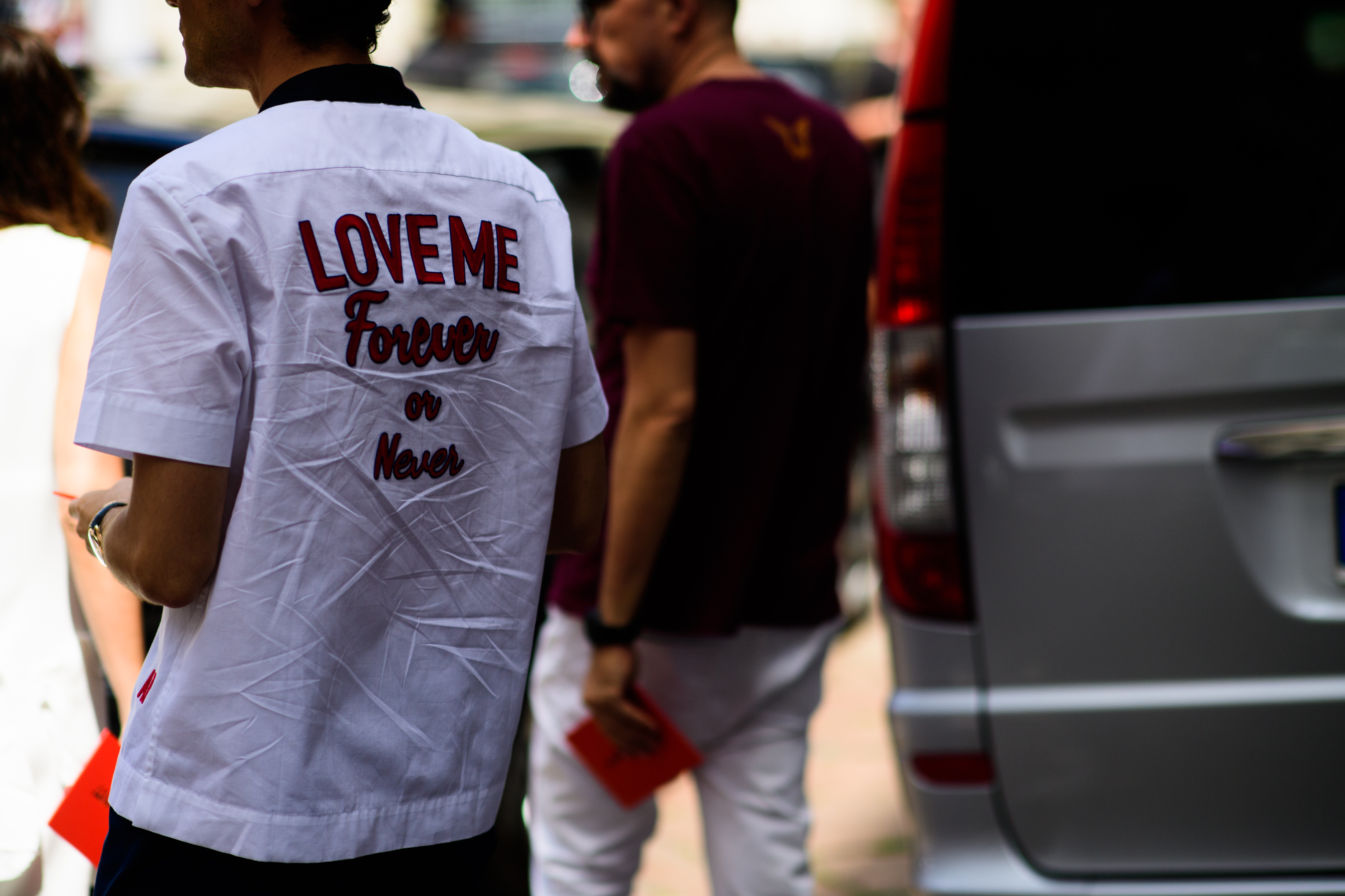 Models wearing white and burgundy oufits