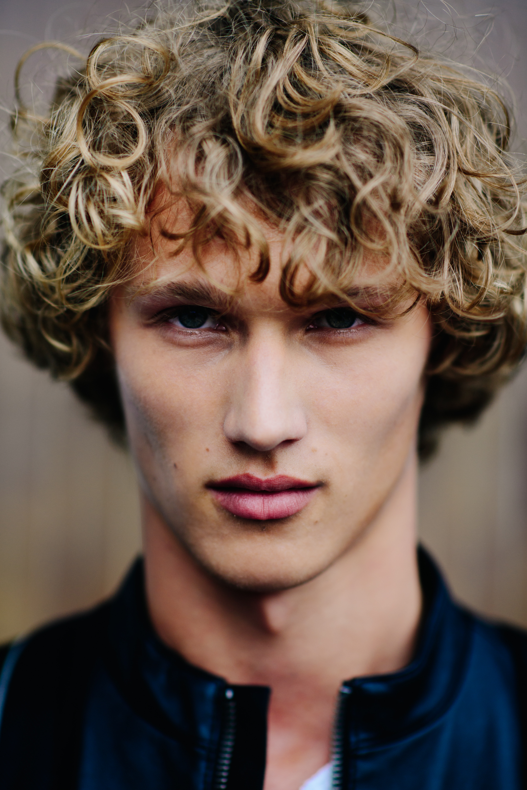 Portrait of a blond curly-haired man