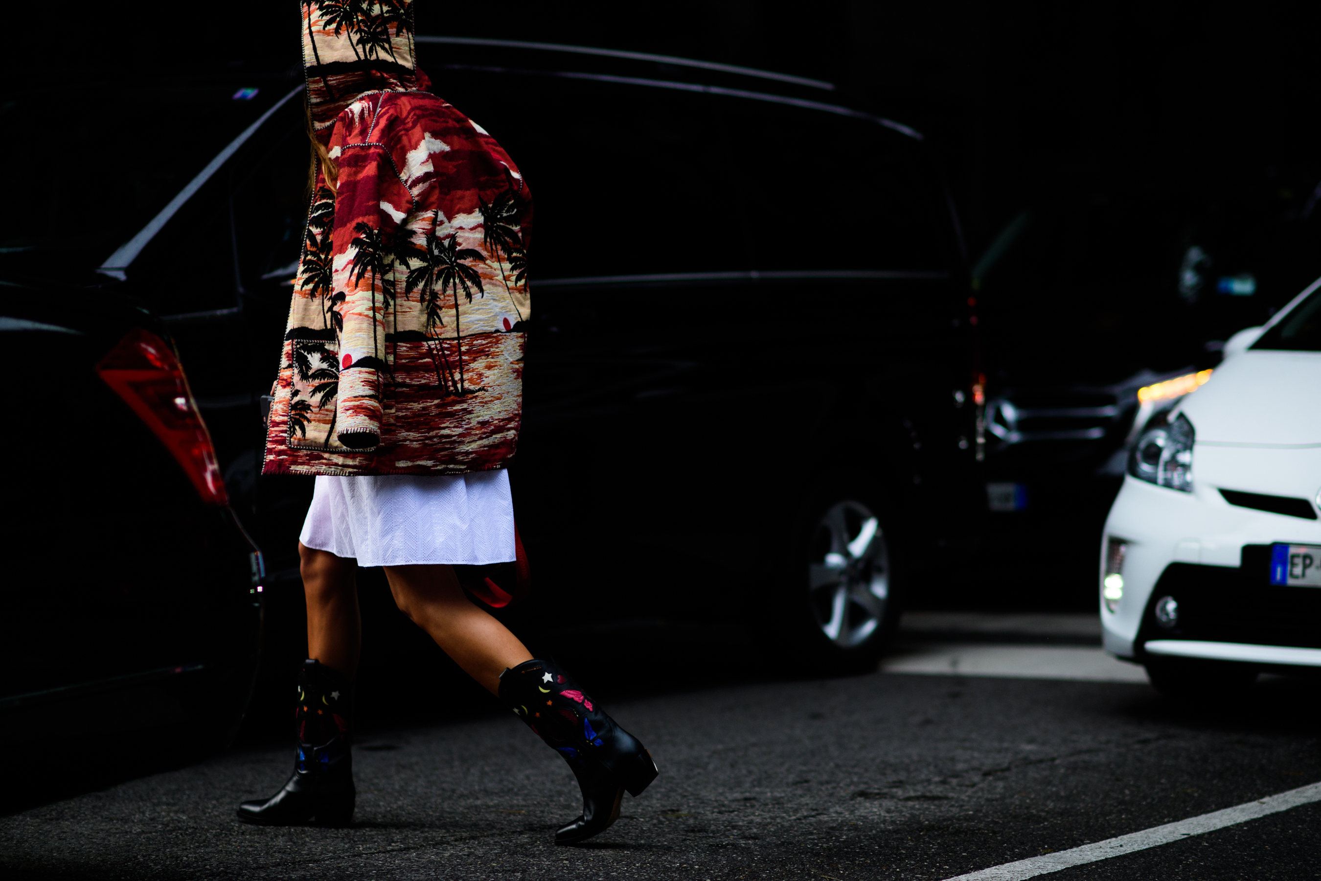 A woman in jacket with palms