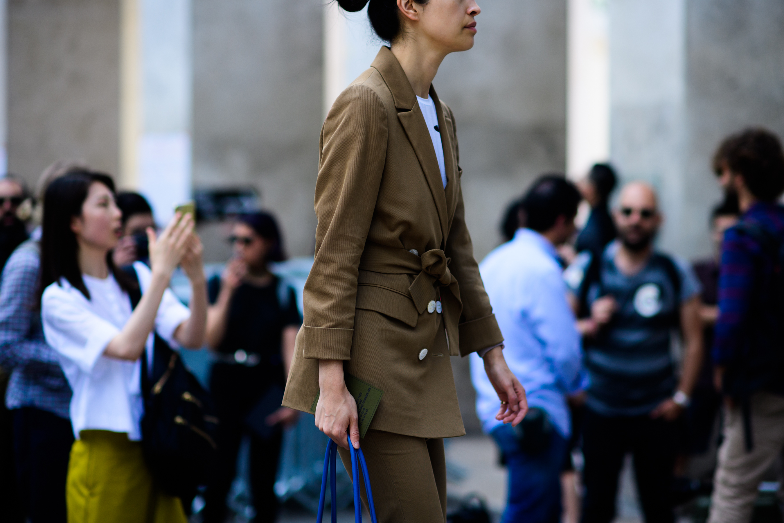 A woman in a light brown suit
