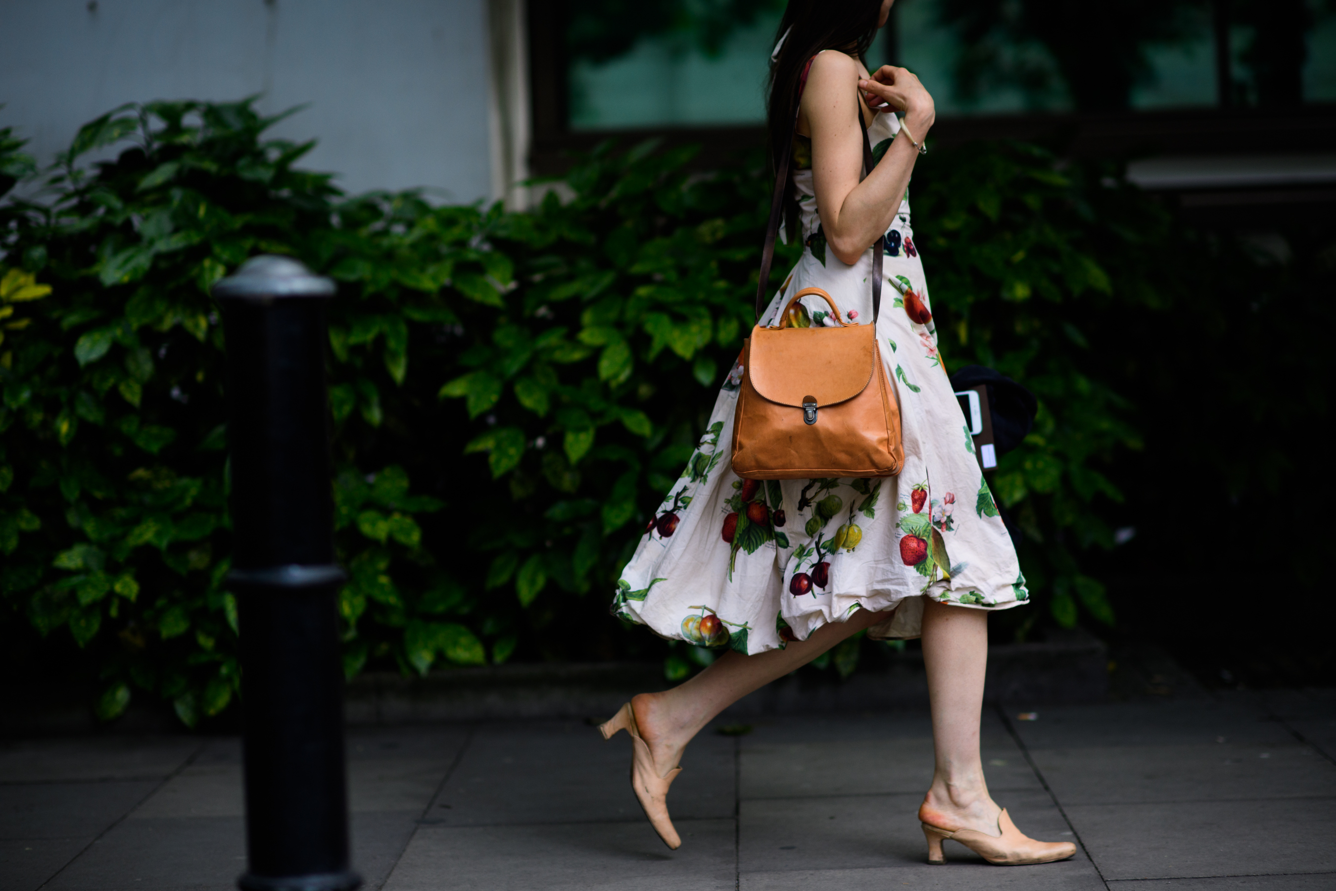Young woman in a printed midi dress