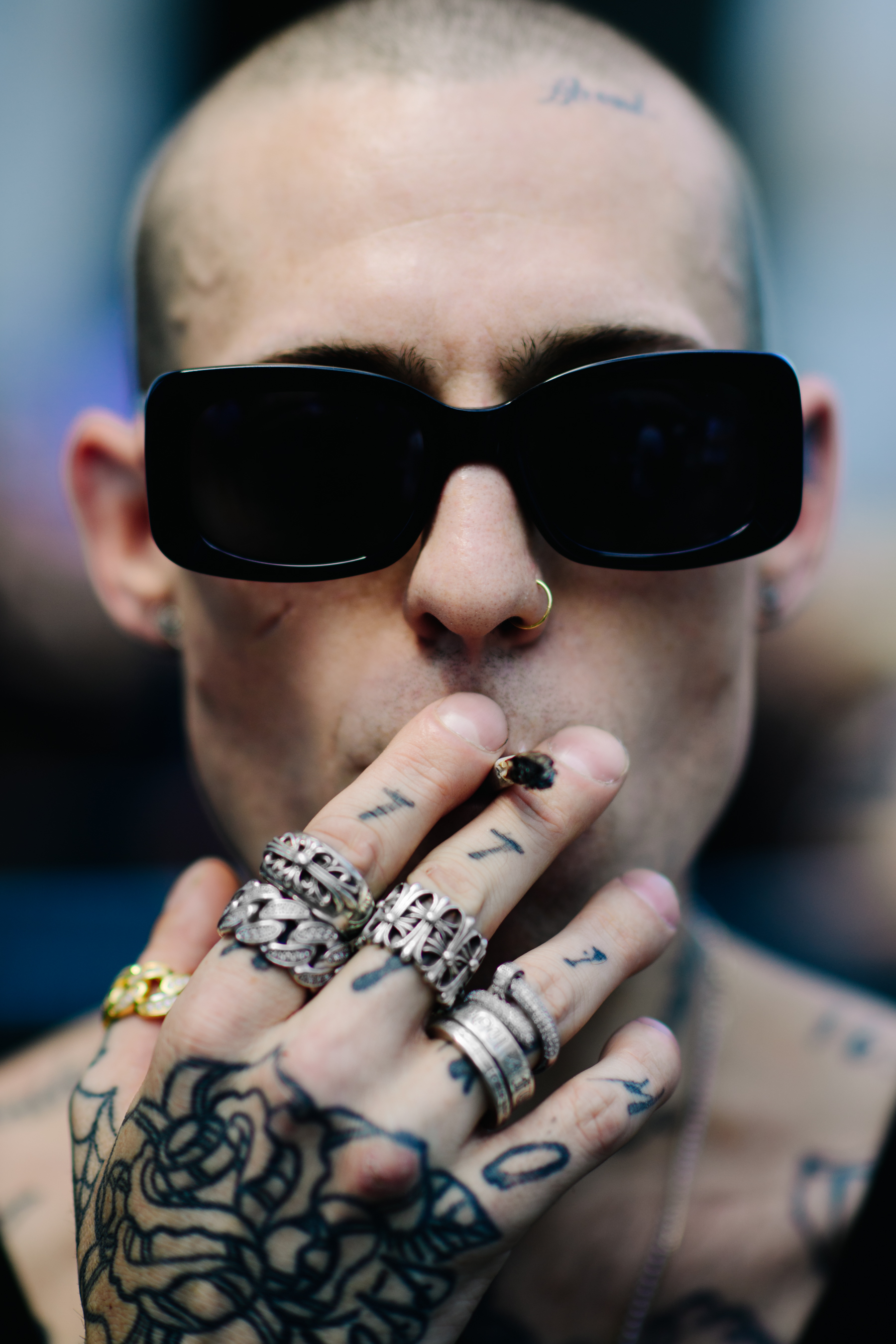 Portrait of a tatooed man in sunglasses