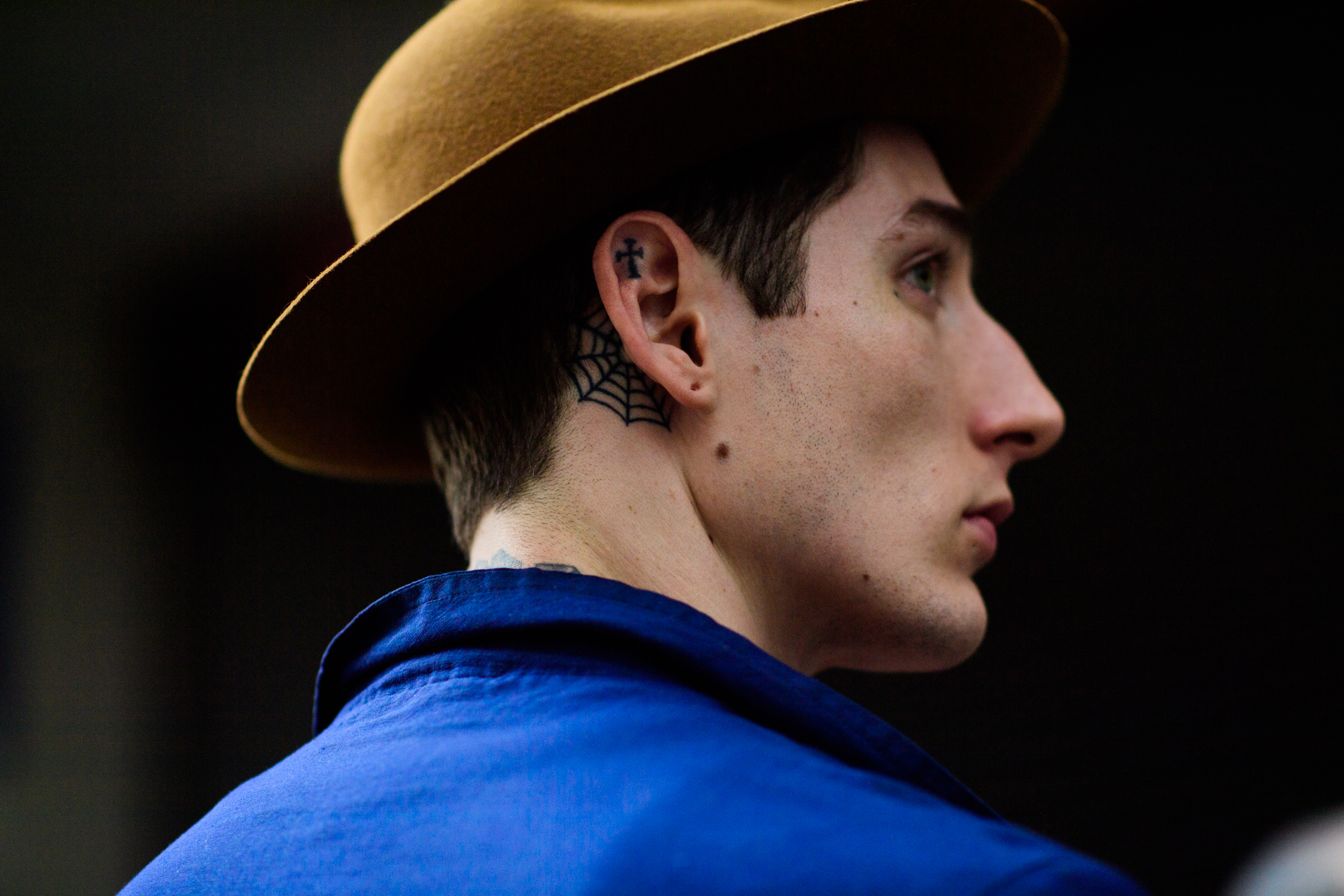 Man in a blue jacket and a hat