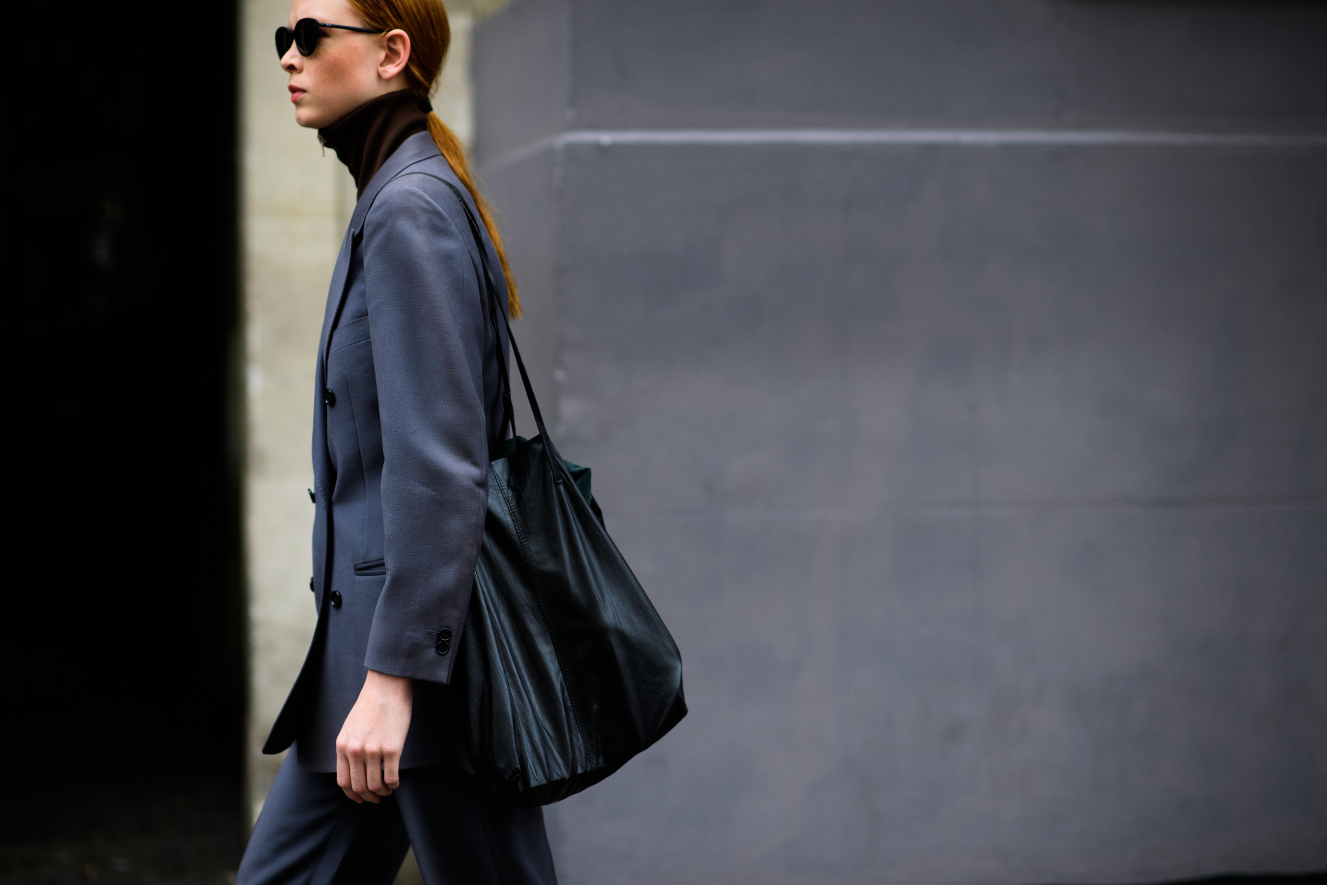 A female model in a grey jacket
