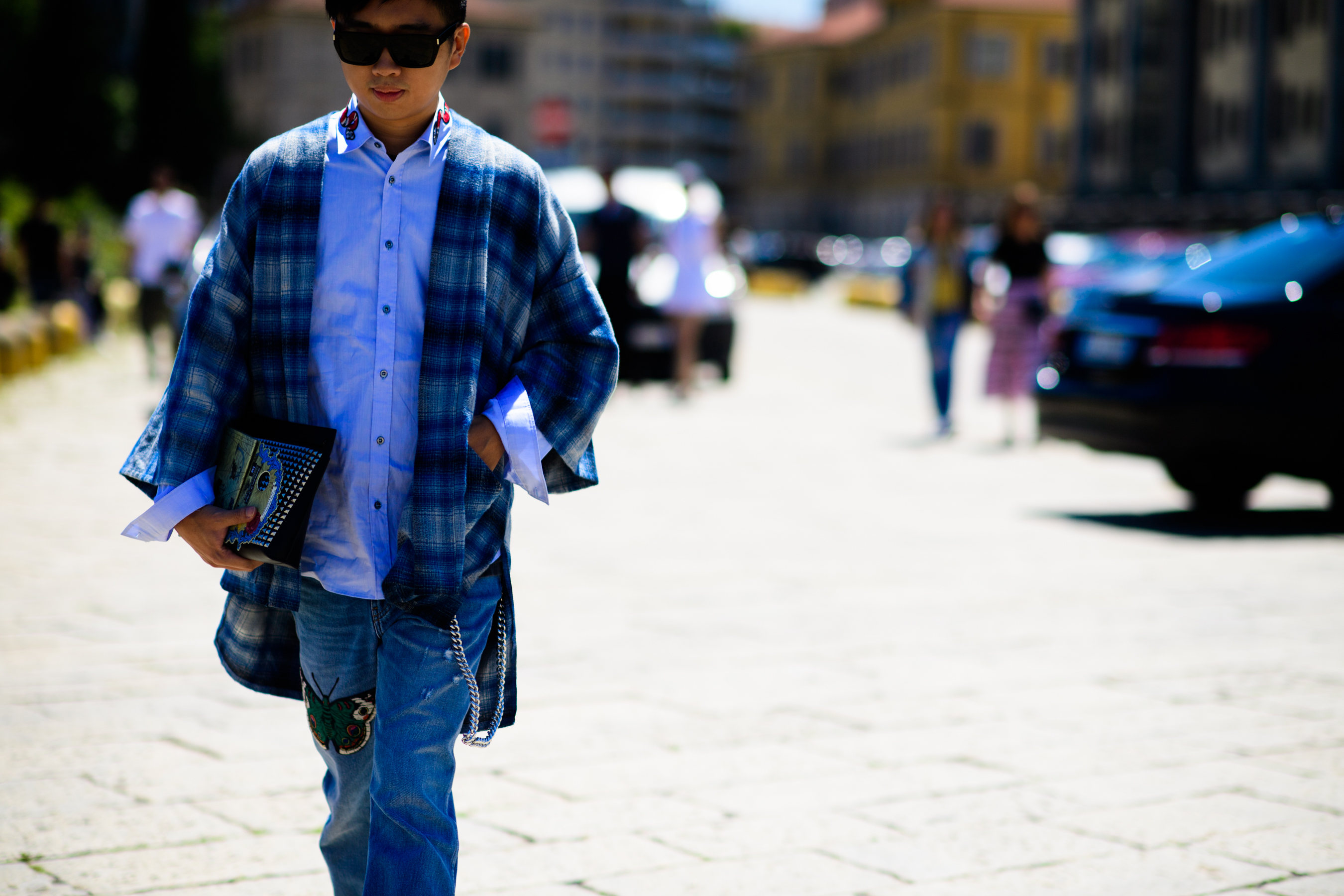 A man in a shirt and blue denim