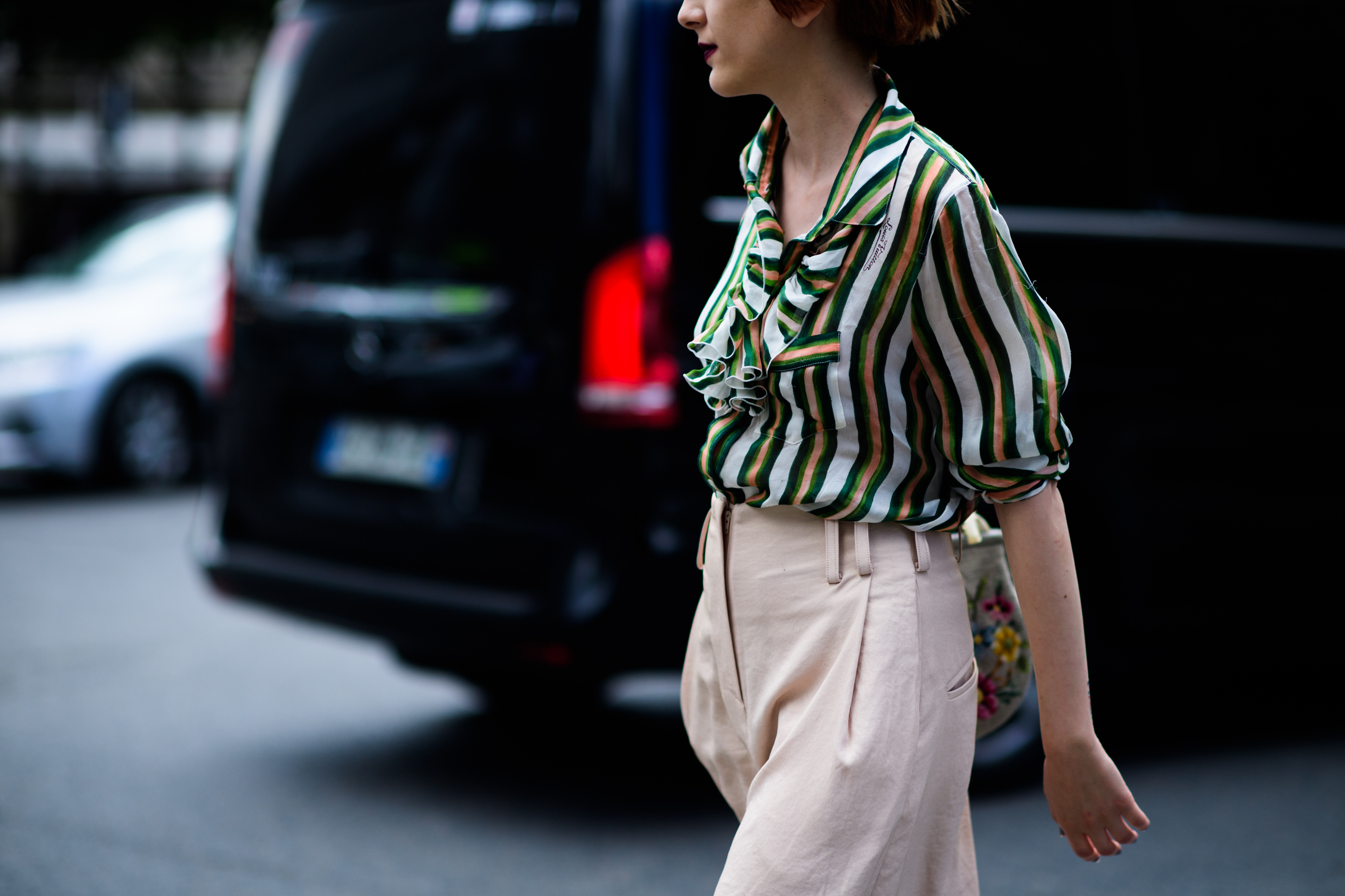 Woman in pastel pink trousers