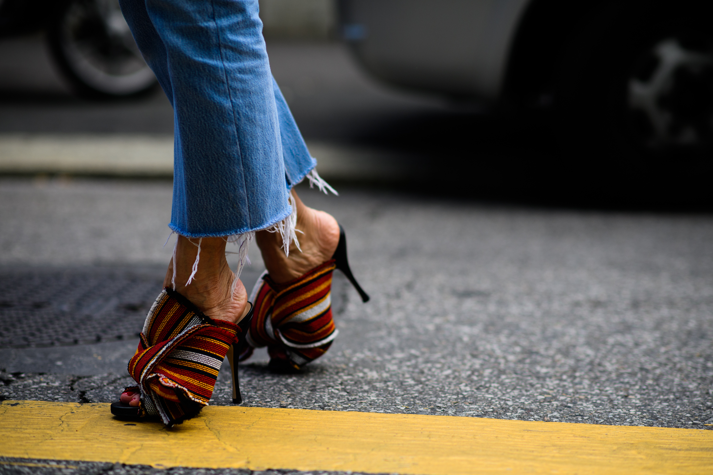 Blue denim jeans and colourful shoes