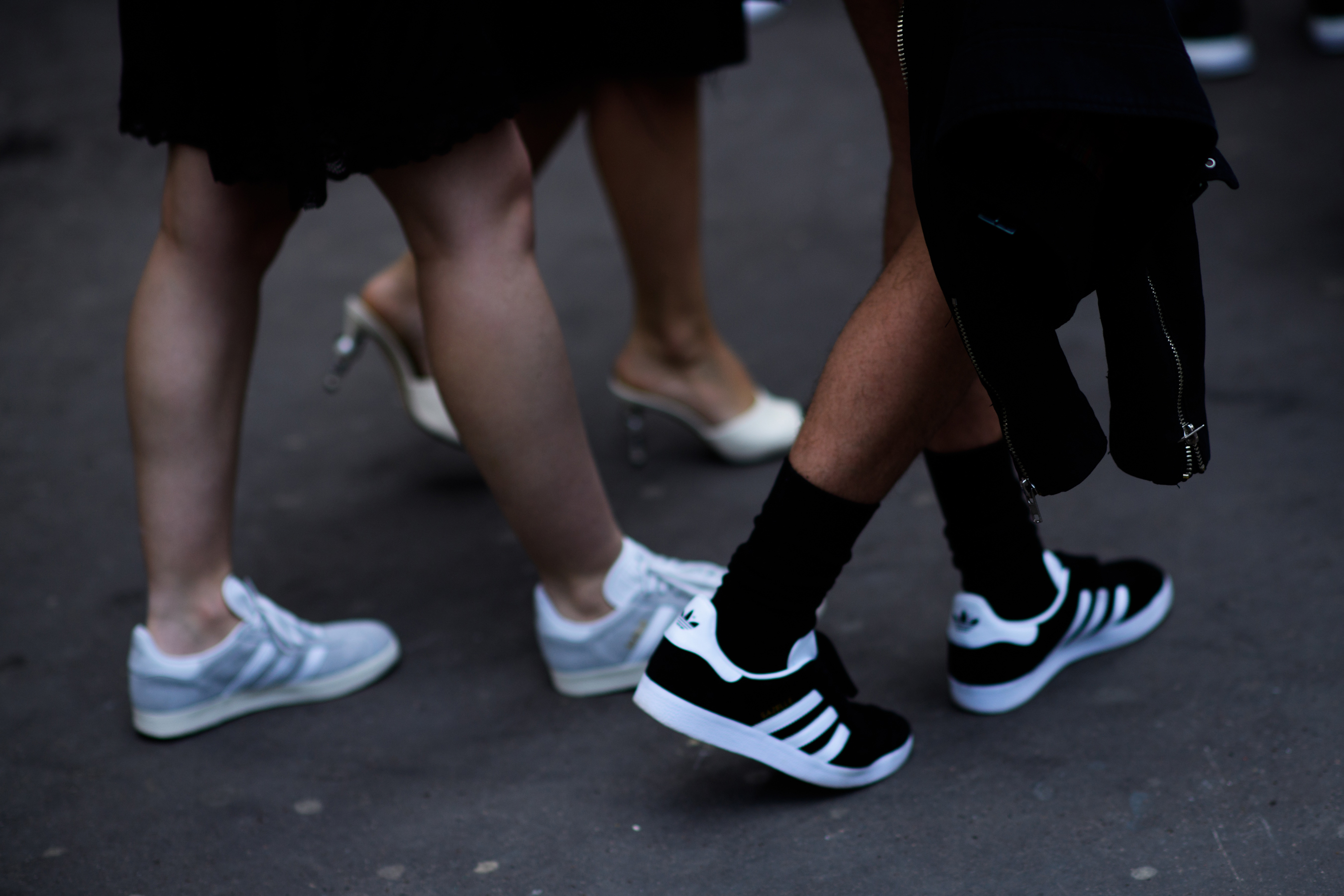 People in black and white sneakers