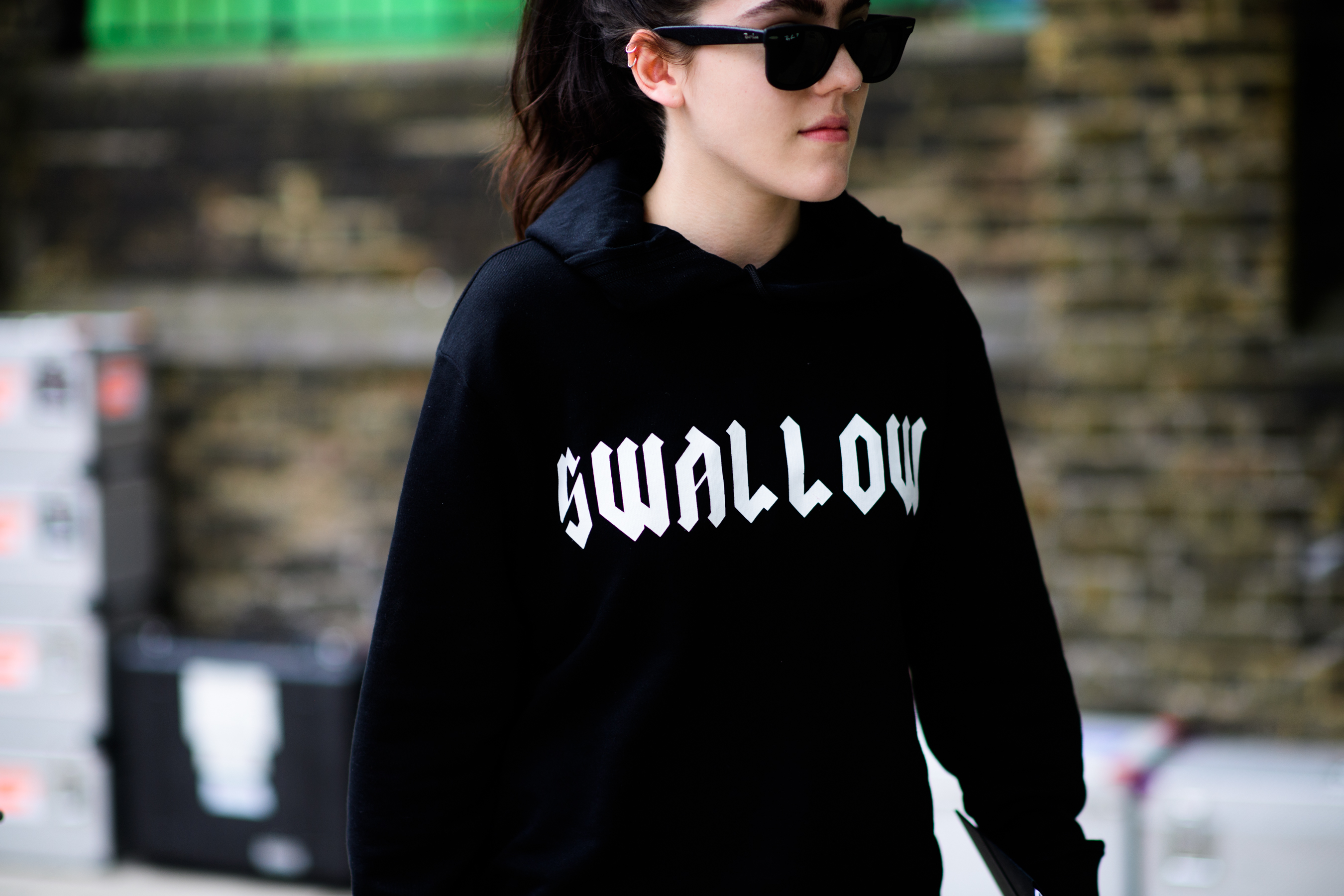 A girl in a black printed sweatshirt