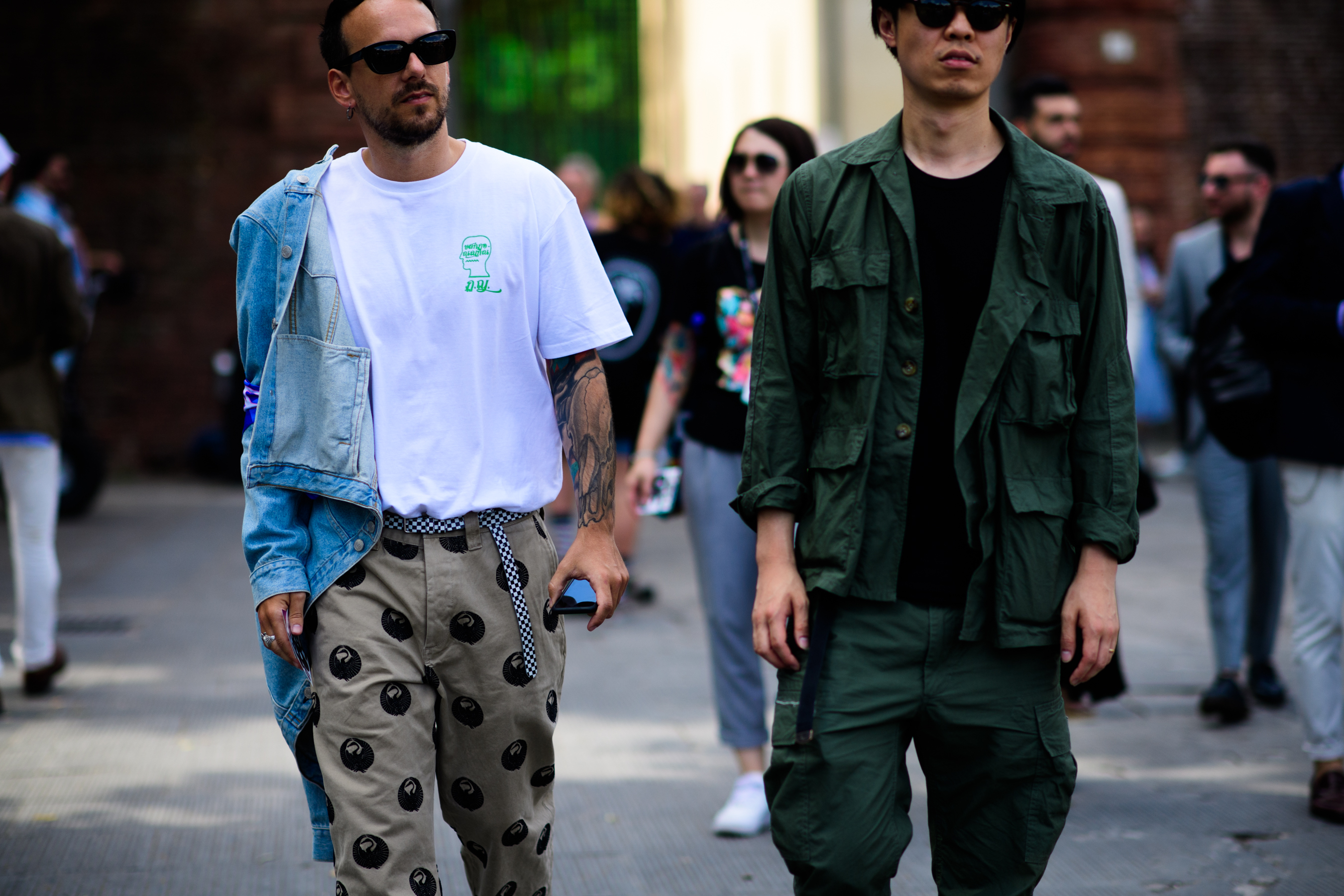 Two men walking outside