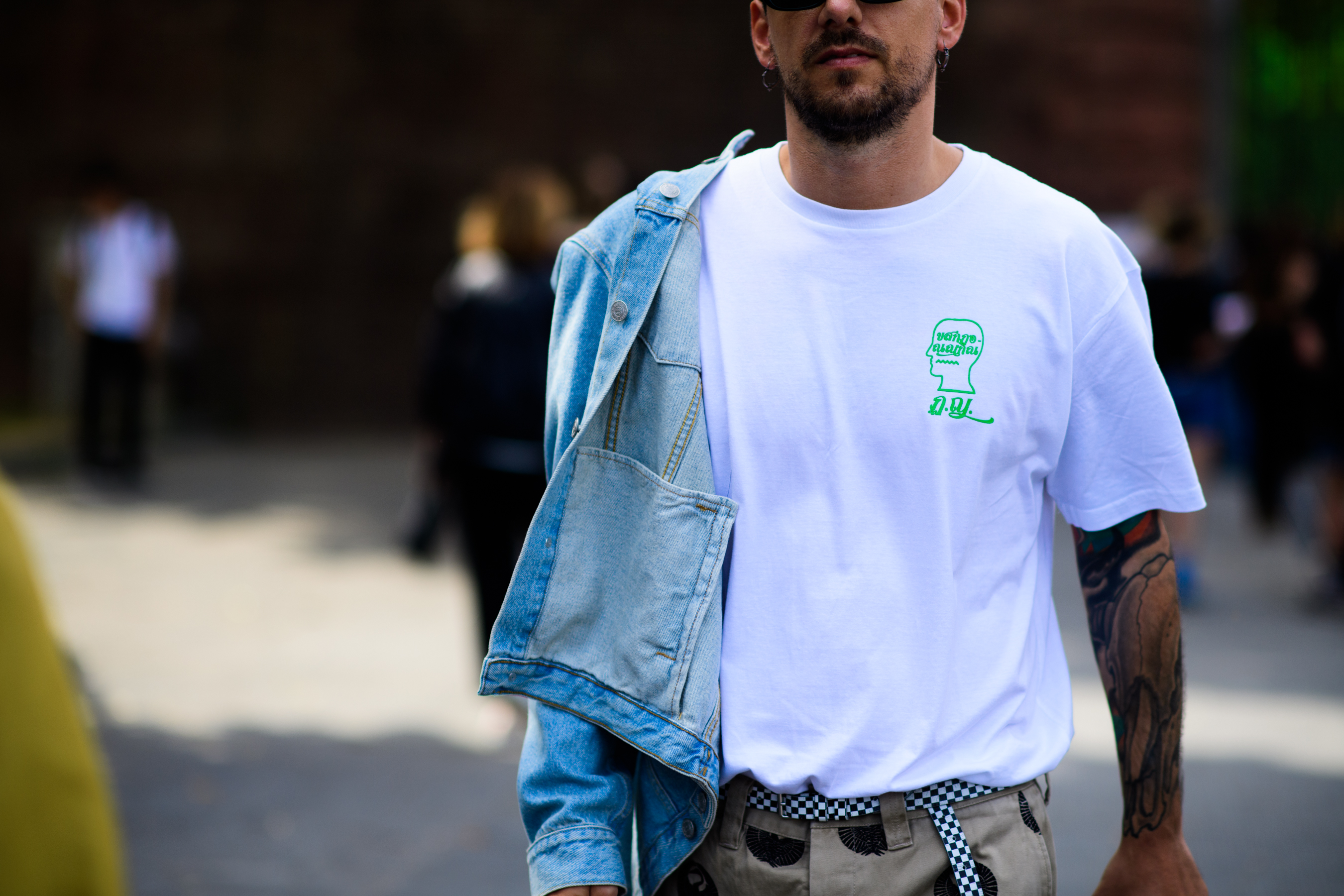 A man in a T-Shirt and a denim jacket