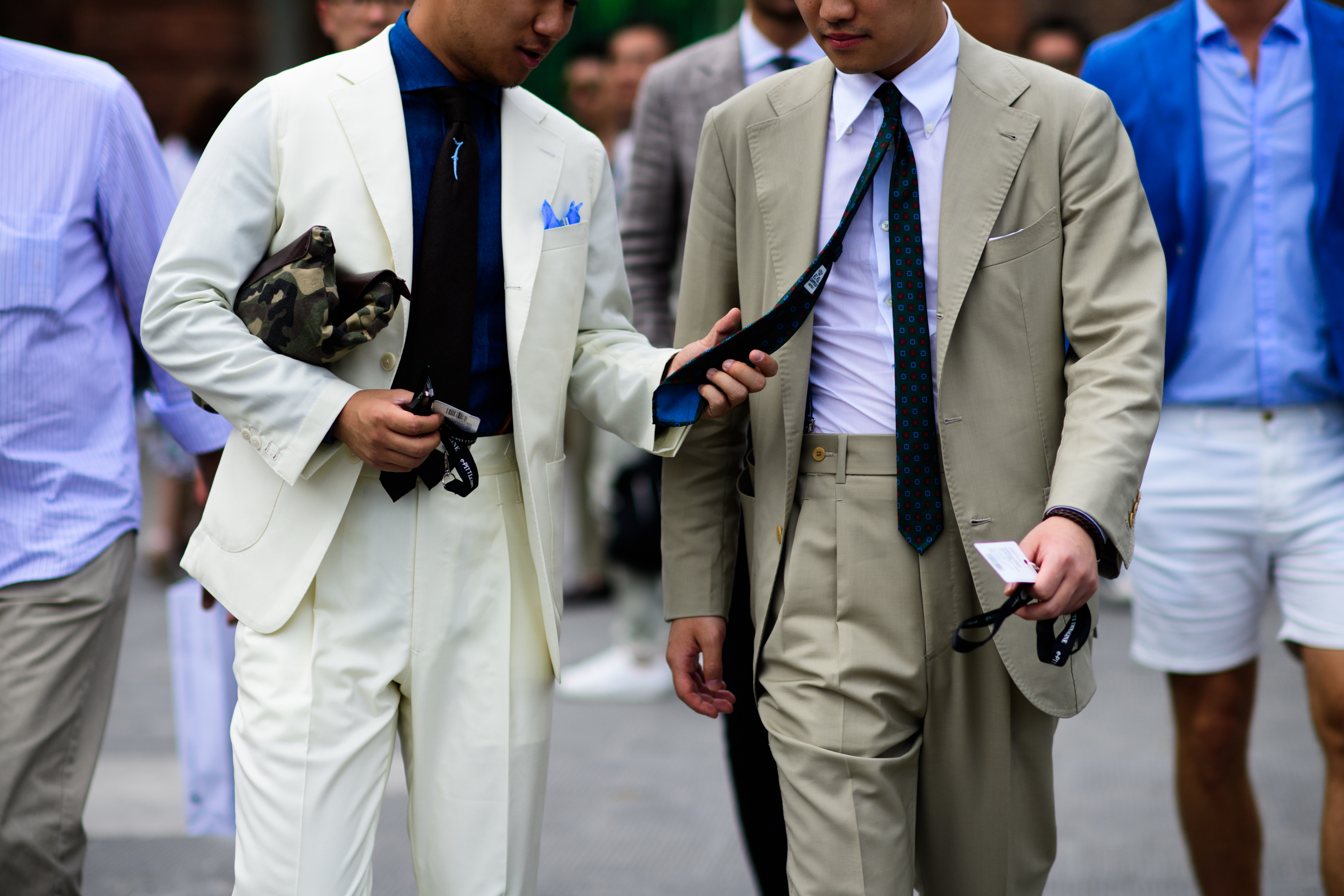 Men in beige suits and ties