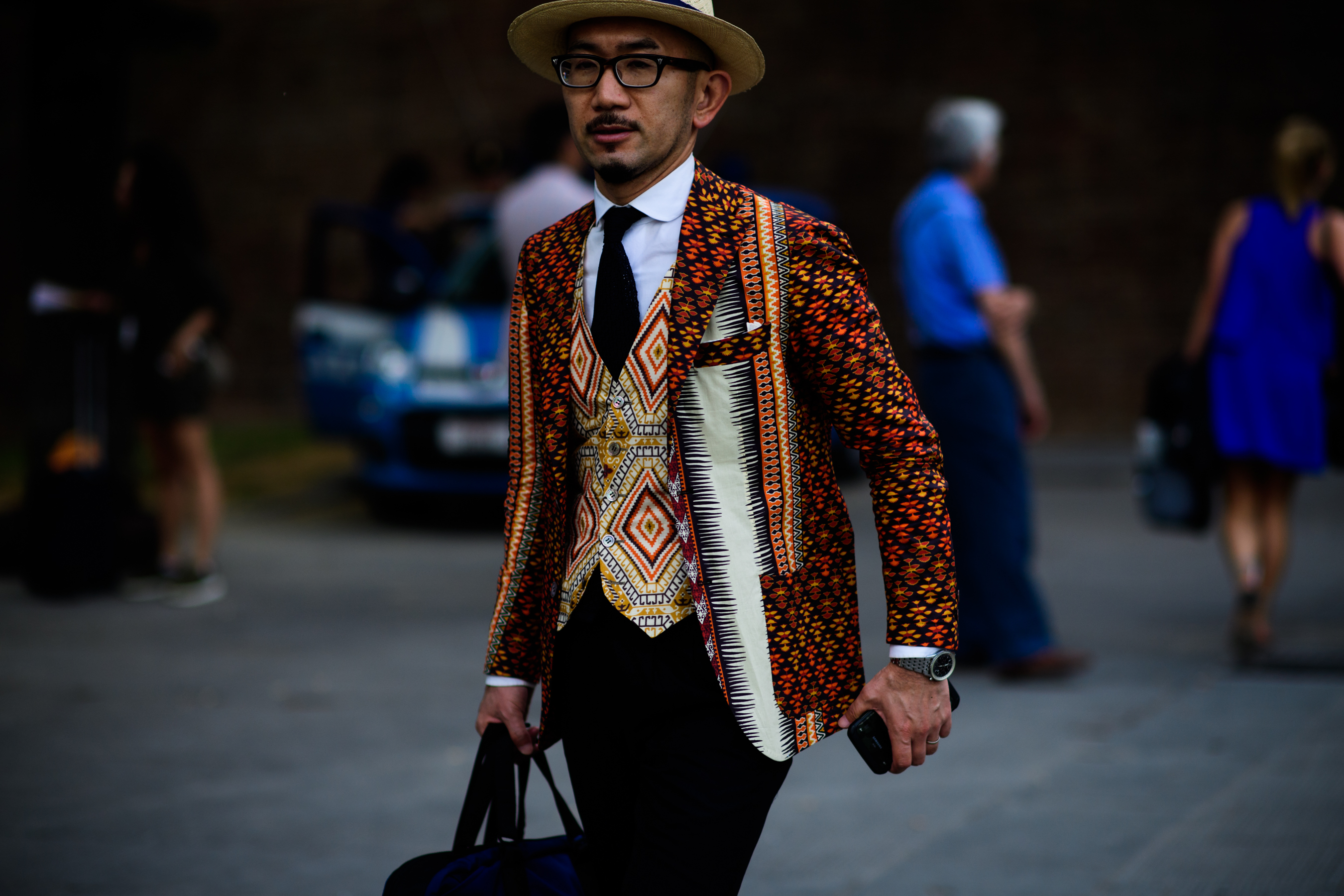 A man in a printed waistcoat and jacket