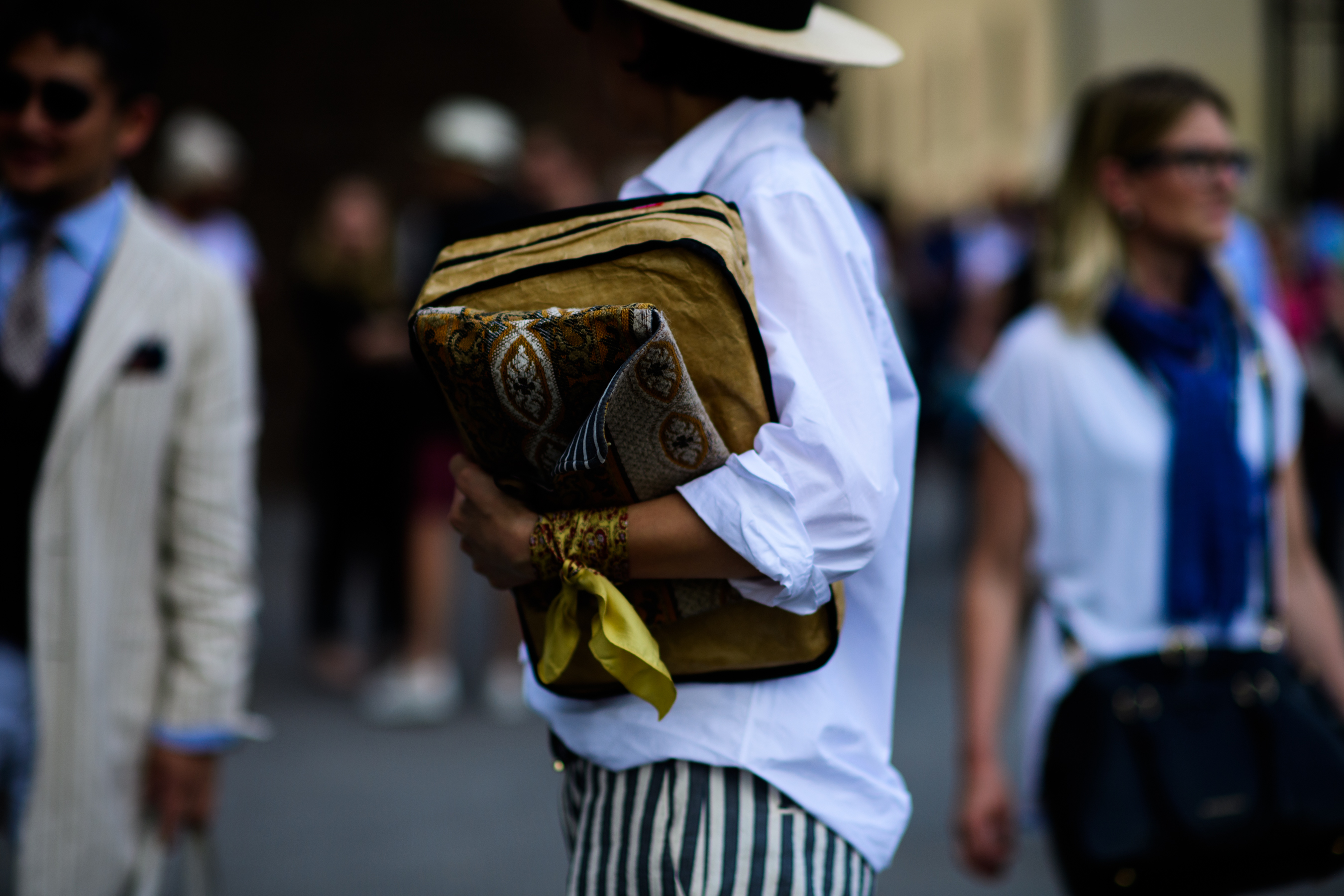 A woman holding a yellow bag