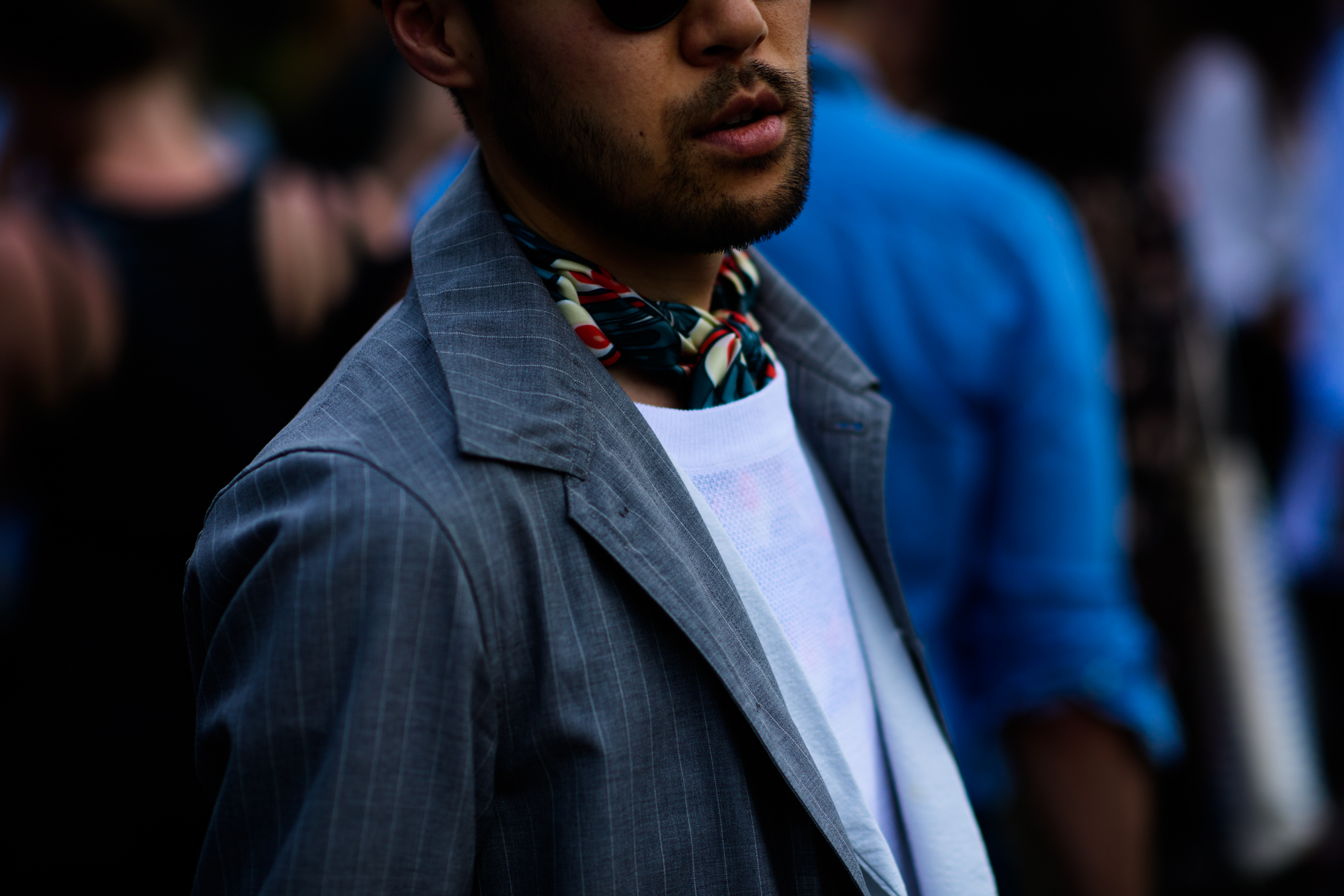 A man in a grey jacket