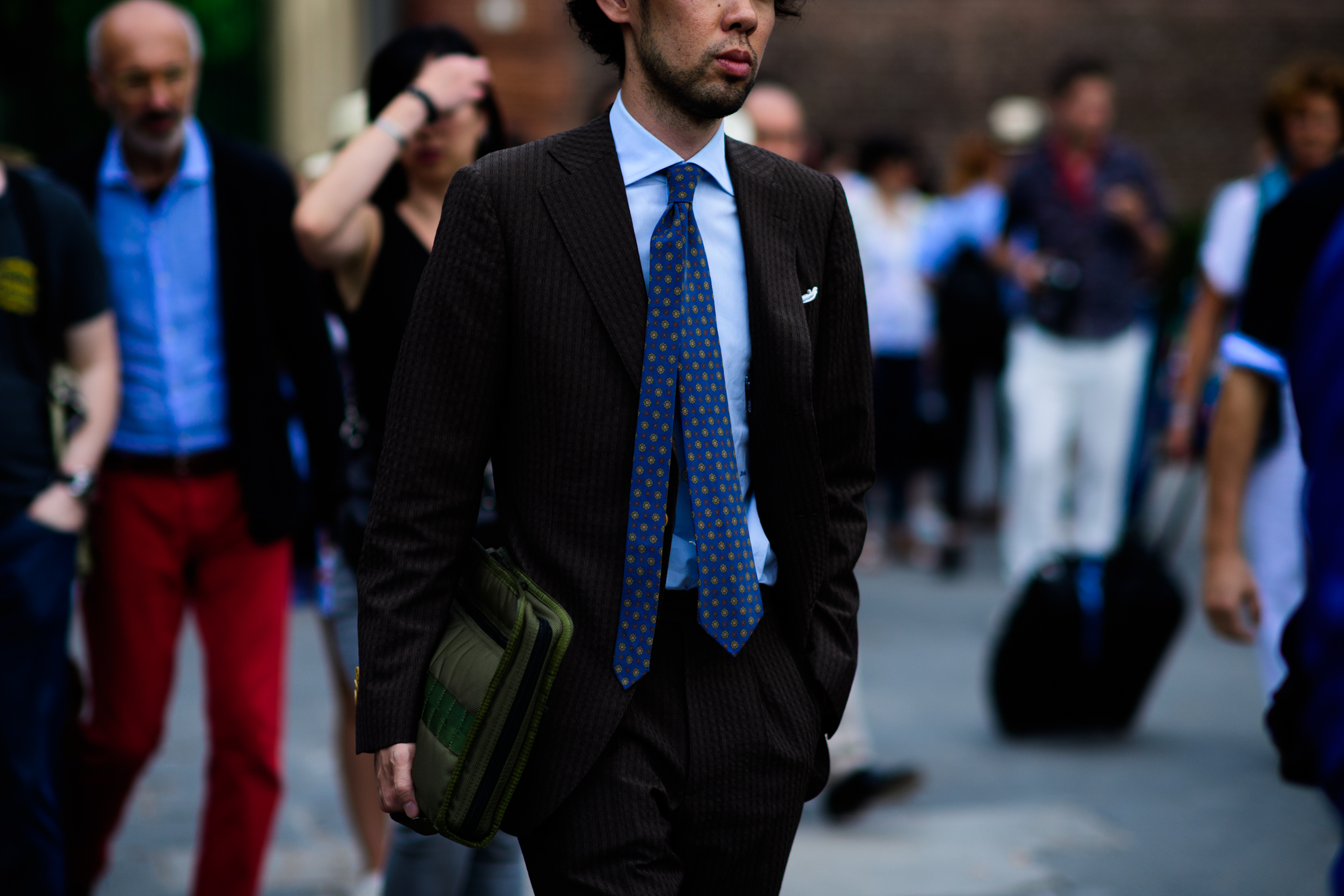A man wearing a dark-coloured suit