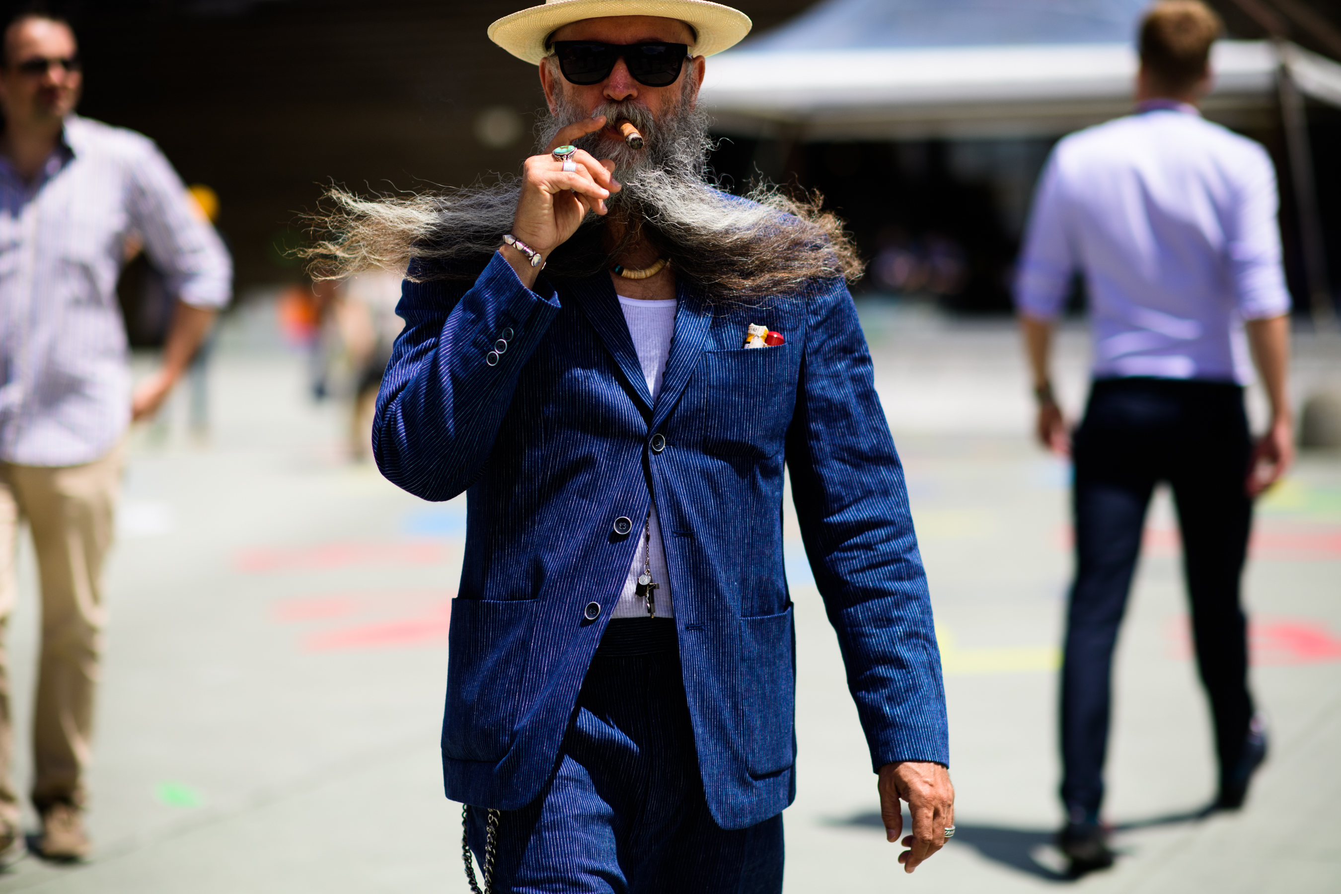 A hat in a blue suit and a beige hat